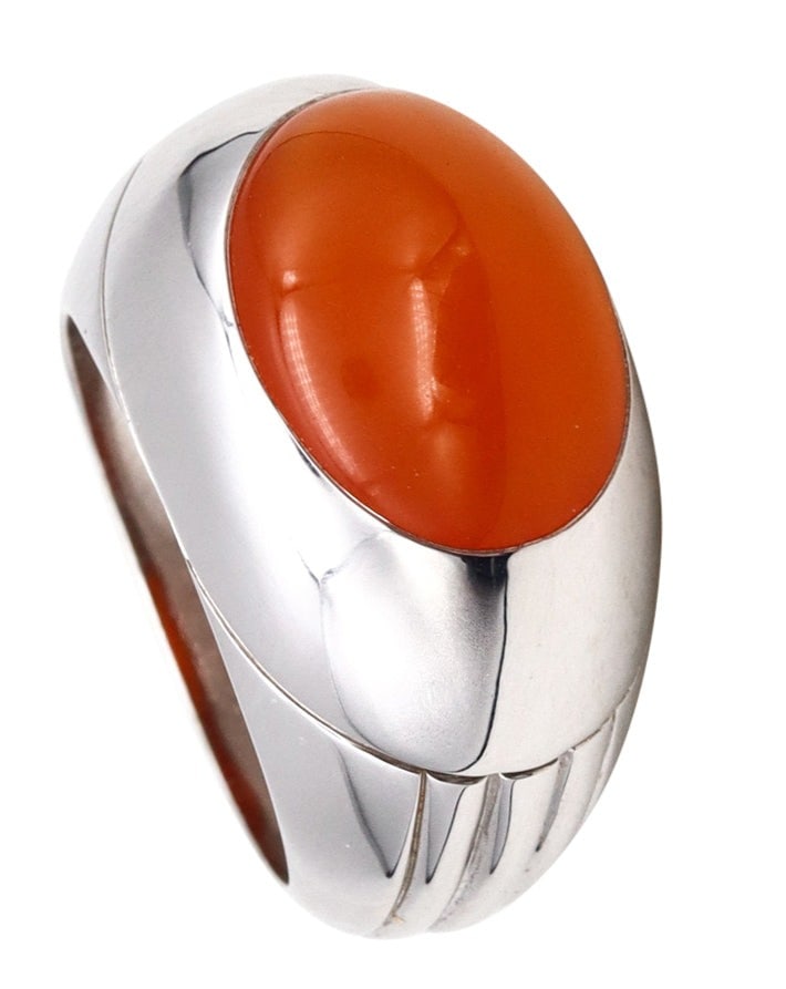 Boucheron Paris Dome Cocktail Ring 18Kt White Gold With Vivid Orangish Carnelian: A modern Boucheron cocktail ring from Paris, France, crafted with bold fluted raised patterns in solid 18k white gold and finished with high-polished surfaces for refined elegance. Bezel-set on top is