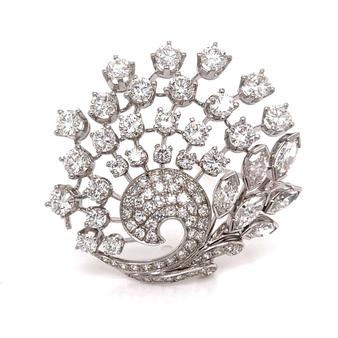 BIRKS Mid-century Platinum 9.60 Ct. Diamond Brooch: BIRKS 1960s platinum brooch—a sculptural tour de force featuring 6 marquise diamonds totaling approx. 1.80 ct, suspended from an ornate foliate frame paved with 79 brilliant diamonds totaling approx