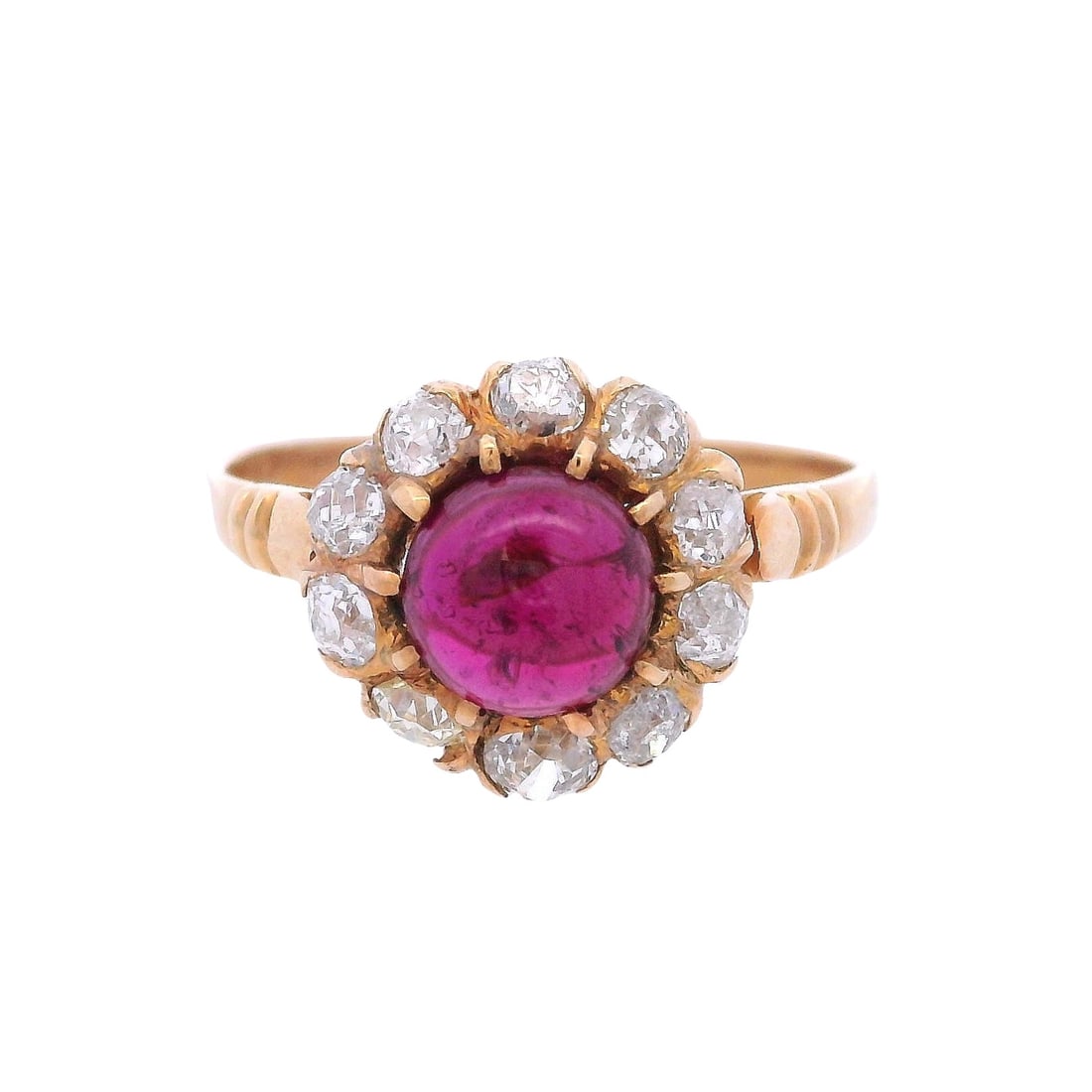 Antique 18kt yellow Gold Rosetta Ring with Pink Tourmaline & Diamonds: Antique Rosetta Ring crafted from 18kt yellow Gold set with a center cabochon Pink Tourmaline of Approx. 1.05 carats. Surrounded by 10 Old mine Diamonds weighing Approx. 0.70 carats. J-K color, VS2-SI