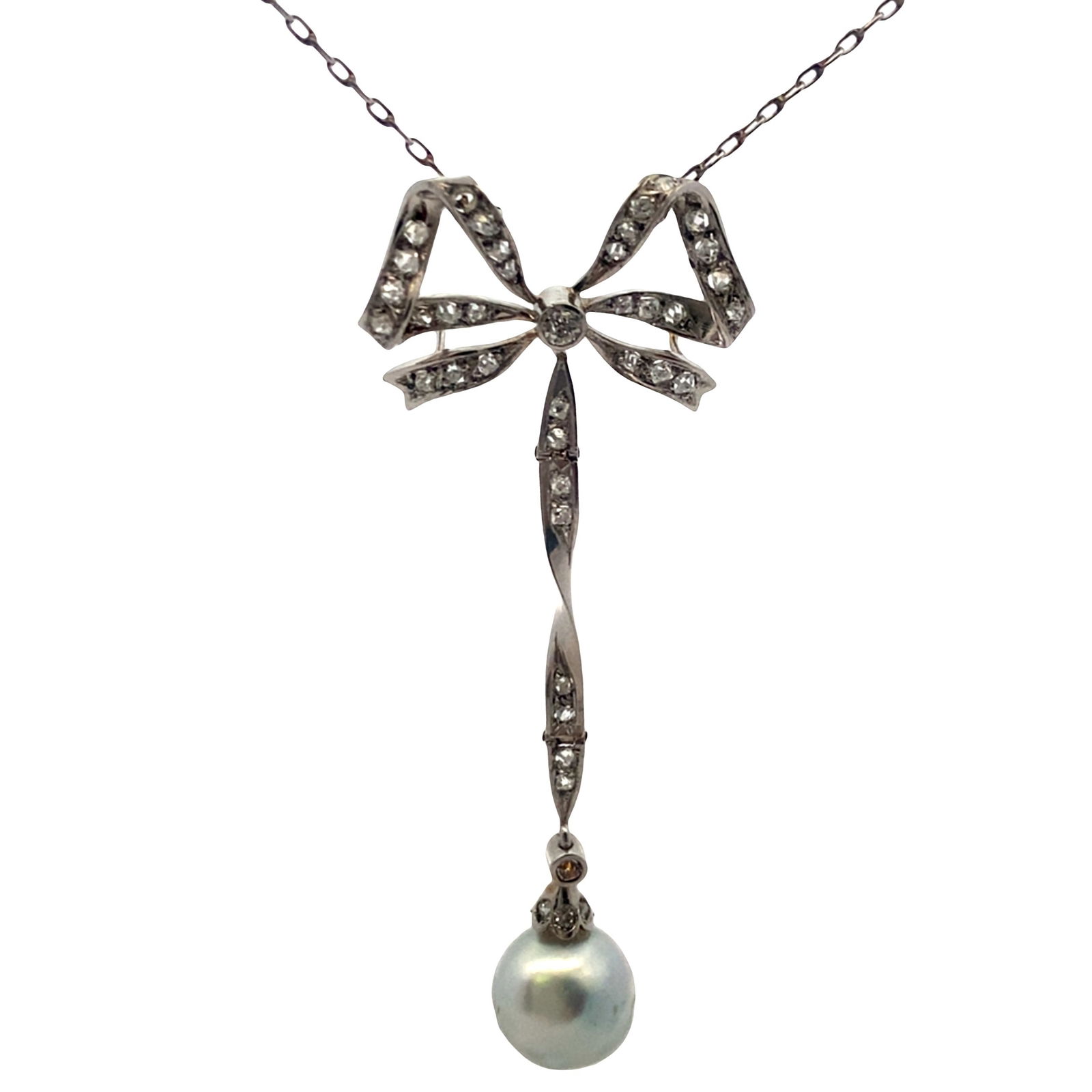 Edwardian Platinum Bow Necklace with Diamonds & Natural Pearl: Edwardian Platinum Bow Pendant Necklace set with a baroque Natural Pearl of 9.50 mm diameter. Accented with Rose cut Diamonds weighing together Approx. 0.30 carats. Pendant measurements:2.40 x 0.94 in