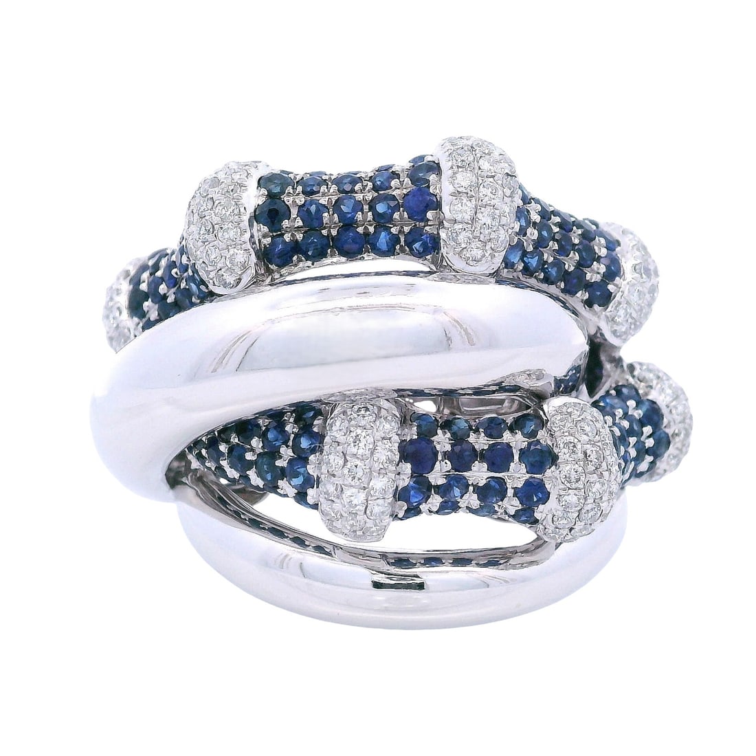 18kt white Gol Cocktail Ring with 2.05 CTW in Diamonds & Sapphires: Cocktail Ring crafted from 18kt white Gold accented with 140 Round cut Blue sapphires weighing Approx. 1.40 carats. Along with 133 Round cut white Diamonds weighing together Approx. 0.65 carats. G col