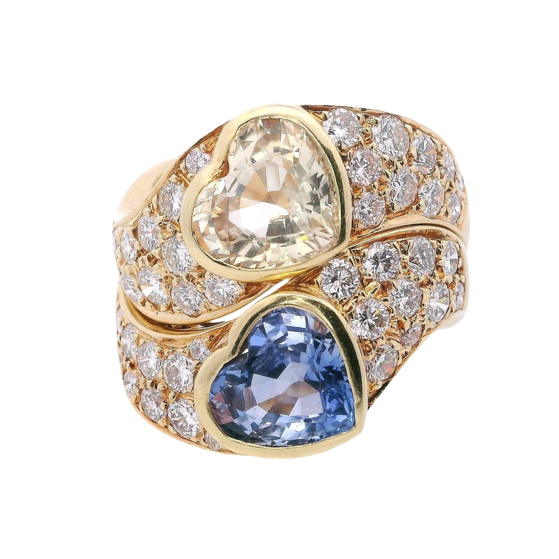 18K Yellow Gold Sapphire & Diamond Stackable Rings: 18K yellow gold stackable rings featuring two heart-shaped sapphires totaling approx. 4.50 ct in vivid blue and golden yellow, each set within a pavé diamond surround of 40 diamonds totaling approx.