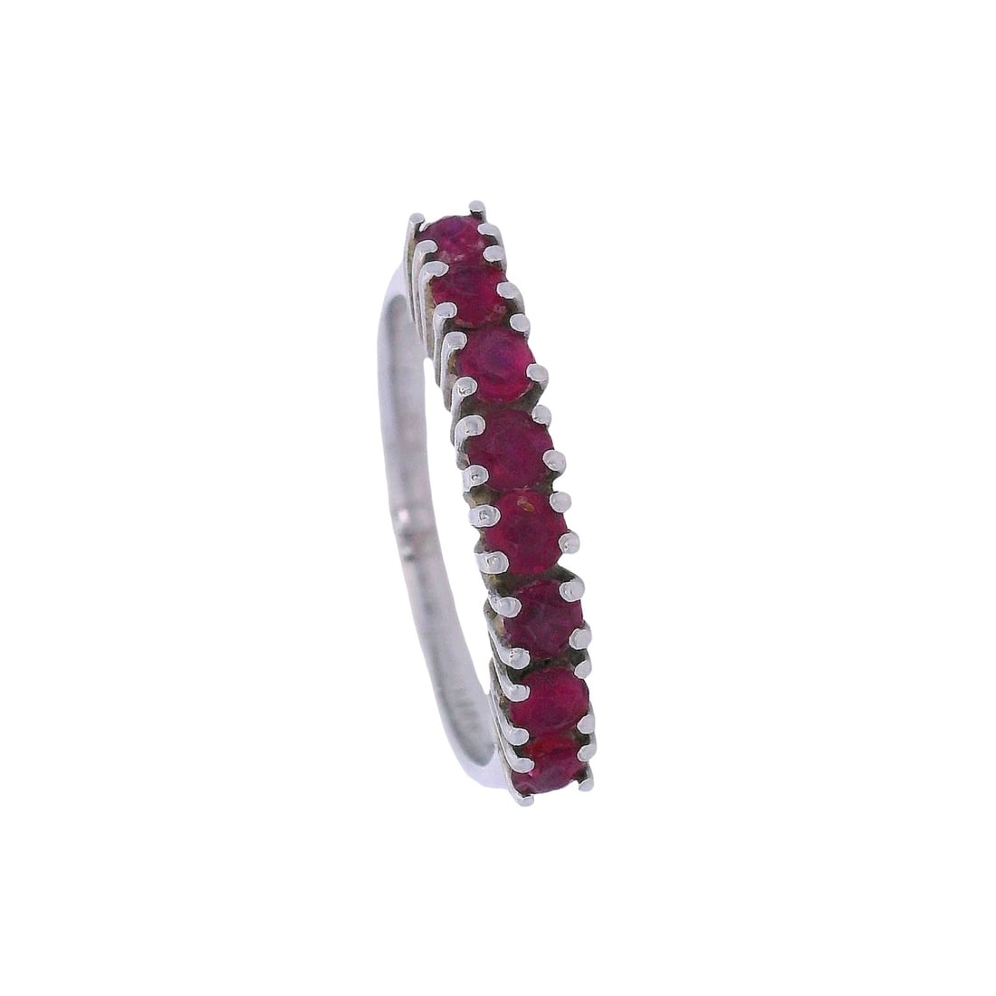 18kt white Gold Half Eternity Ring with Rubies: Half Eternity Ring crafted from 18kt white Gold accented with eight Rubies weighing Approx. 0.80 Carats. Ring size: 6 3/4. Total weight:2.4 grams. Ring width: 0.15 inches.