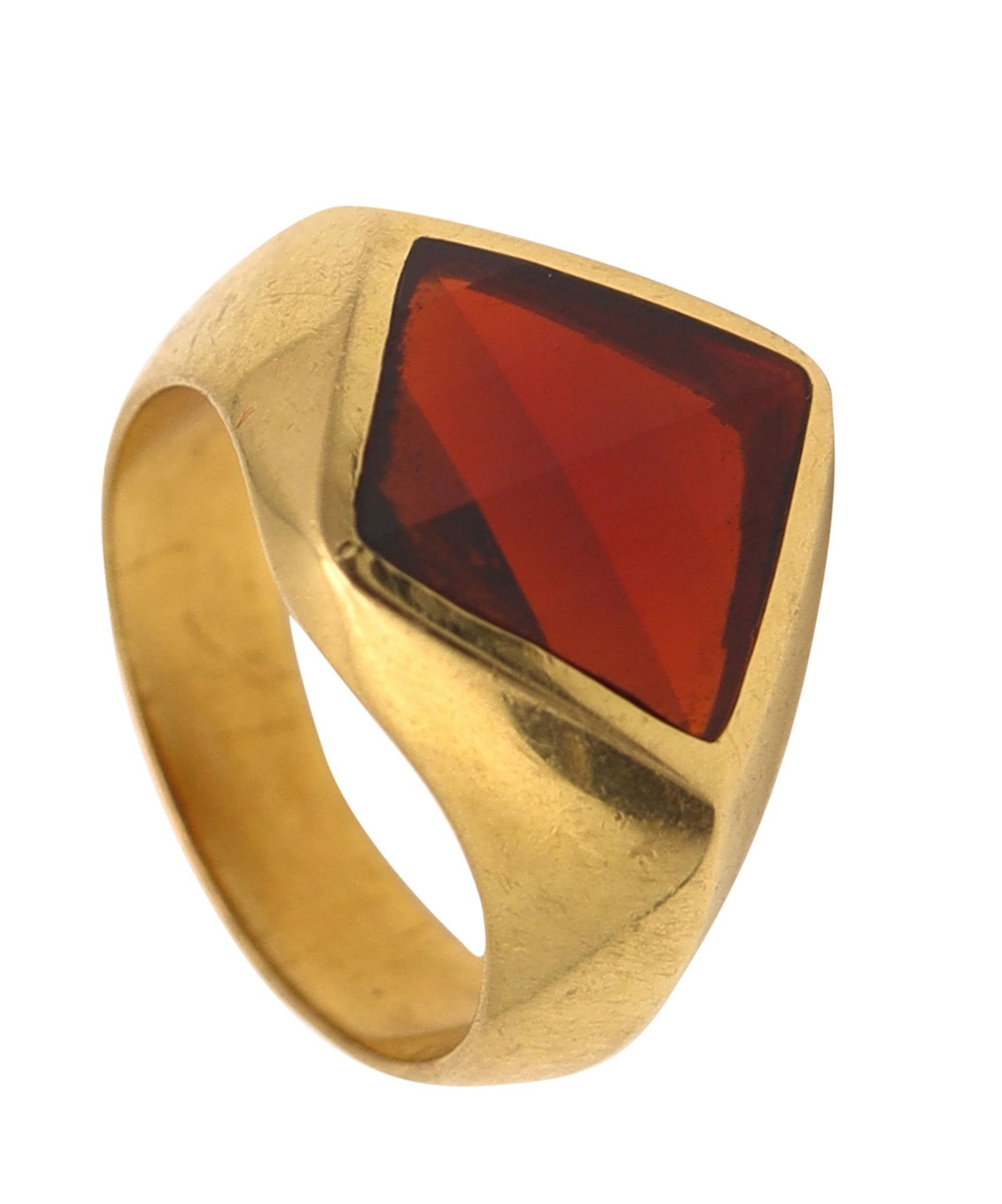 POMELLATO Cocktail Ring In 18Kt Yellow Gold With Kite Garnet: A sleek vintage cocktail ring by Pomellato, Milano—understated elegance in high-polished 18K yellow gold crowned by a striking 3.5-carat kite-faceted red garnet in bezel setting. Italian hallmarks a