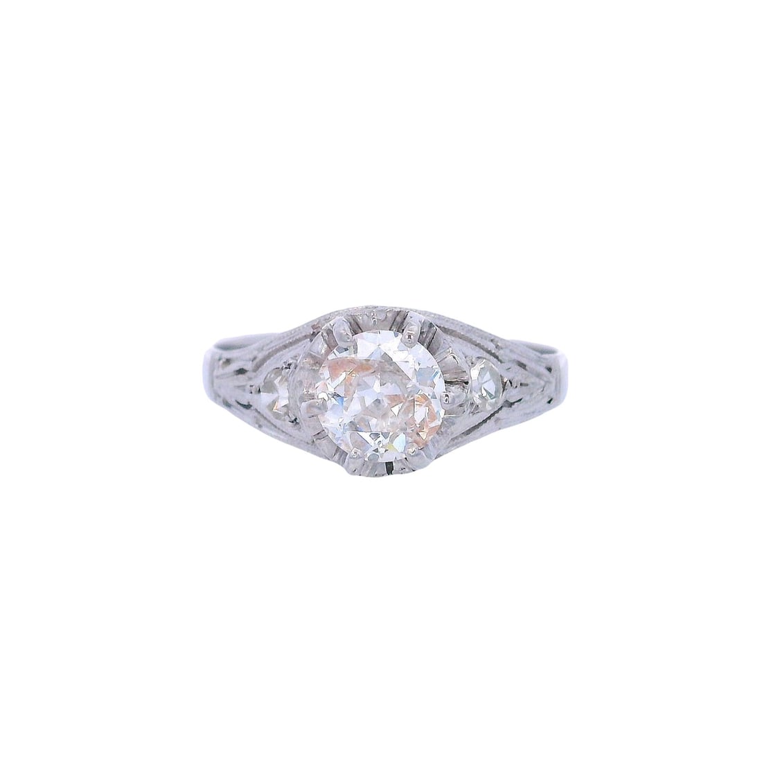 Antique Platinum Engagement Ring with Diamonds: Circa 1910s. Antique Engagement Ring crafted in Platinum featuring a center transitional cut Diamond Approx. 0.80 carats. J color, SI2-I1 (eye clean). Along with two Single cut Diamonds weighing