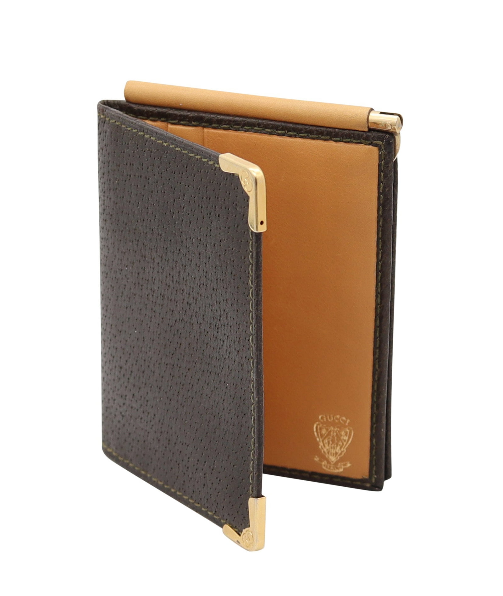 GUCCI Milano 1970 Vintage Foldable Thin Wallet In Brown Leather & Gilt Bronze: Milan, Italy, 1970s. Vintage foldable wallet by Gucci, crafted in fine leather with gilt metal corner guards for protection, designed in a notably slim profile. Marked in gilt to the leather with make