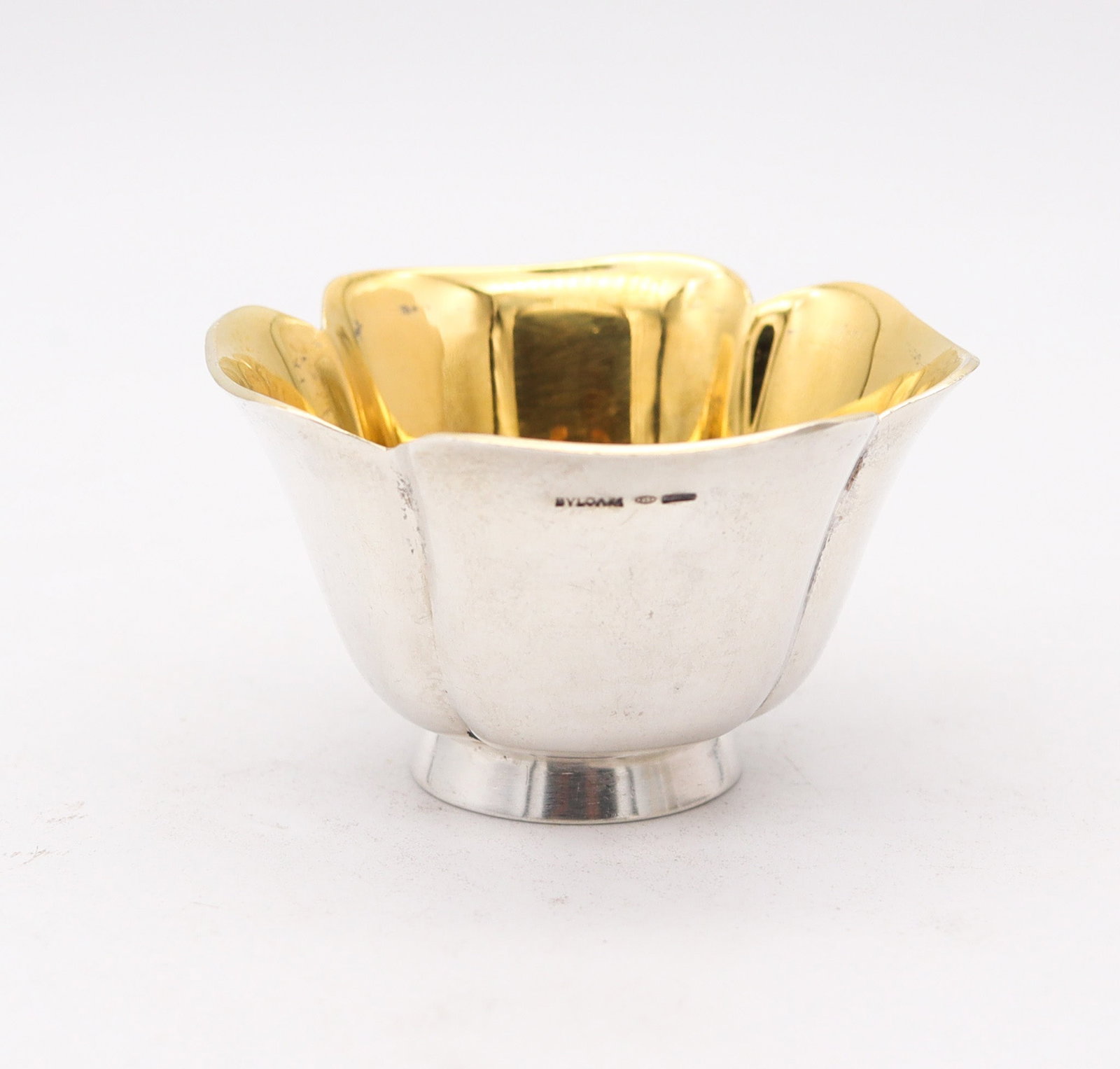 BVLGARI Roma 1970 Quatrefoil Vase In Solid .925 Sterling Silver & 24kt Gilding: Italy, Modernist period (c. 1970s). Versatile Bulgari quatrefoil cup/vase, suitable as a salt cellar or caviar dish, crafted in high-polish .925 sterling silver with 24K gold-gilt interior. Dimensions