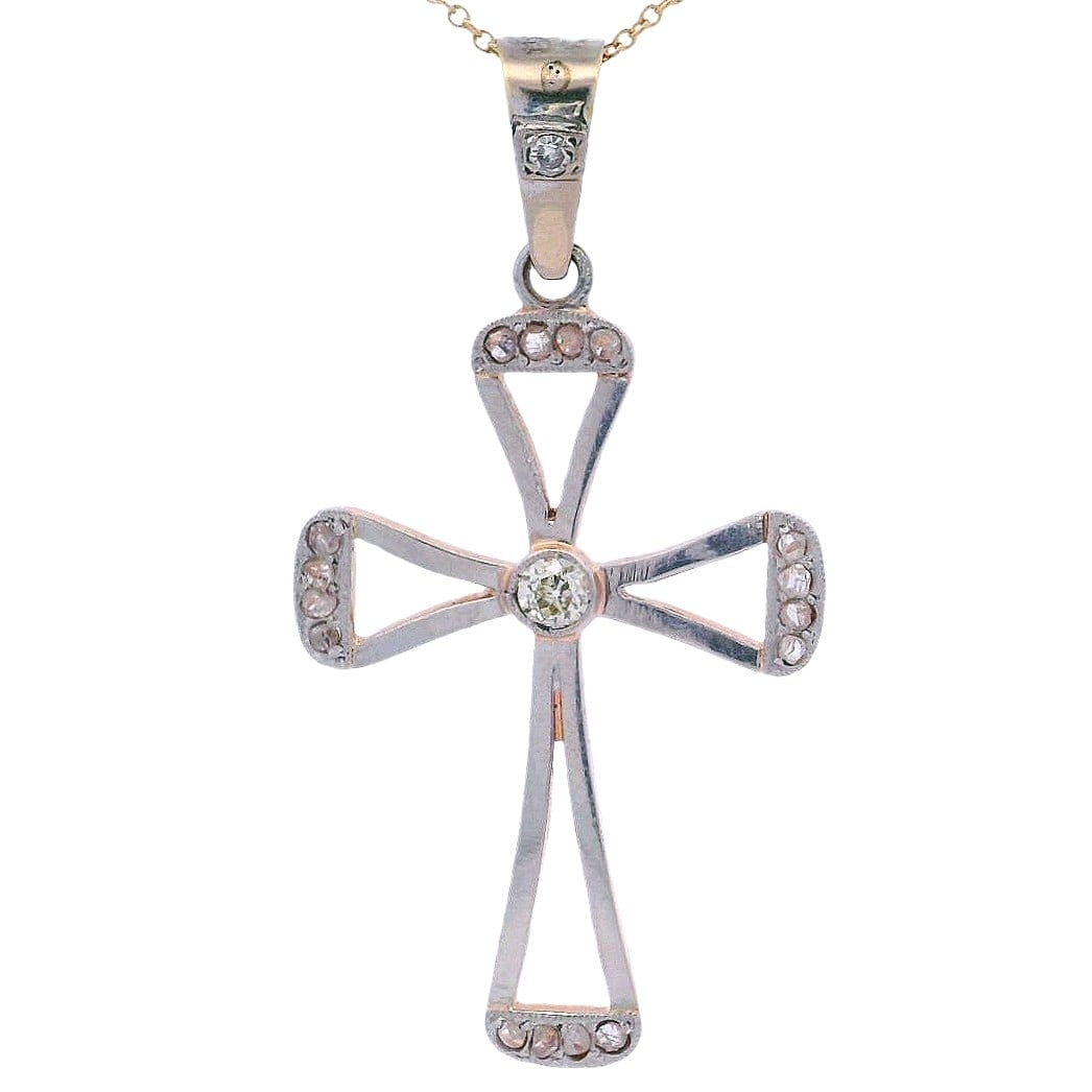 Vintage 18kt Gold& Platinum Cross Pendant with Diamonds: Vintage 18kt yellow Gol & Platinum on top Cross Pendant accenter with a center Old mine Diamond of Approx 0.15 carats. VS2 clarity, K color. Accenter with Rose cut Diamonds. Measurements: 1.80 x 0.95 