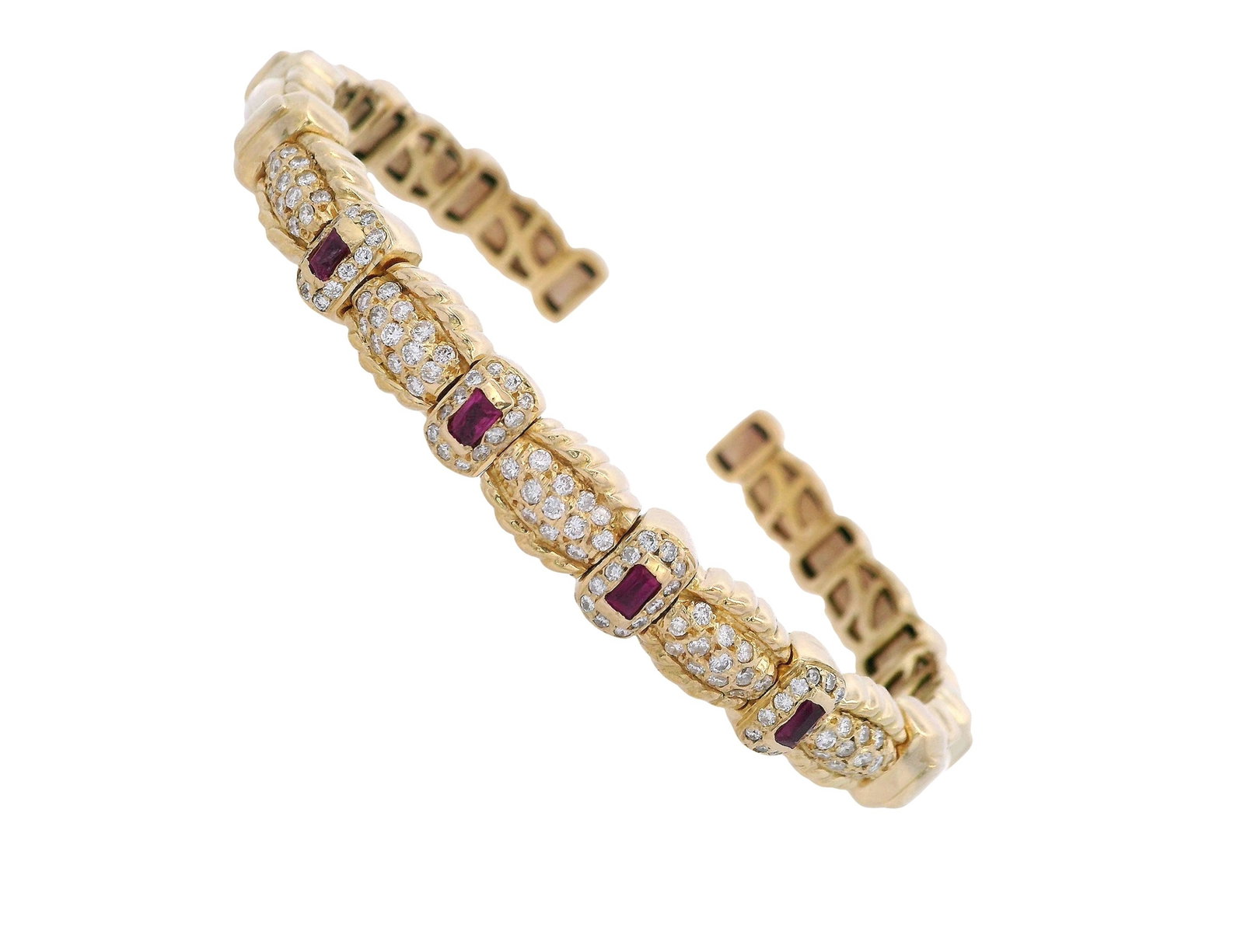 18kt yellow Gold Cugg Bracelet with 1.50 Ctw in Diamonds & Rubies: 18kt yellow gold Cuff Bangle featuring four Baguette cut Rubies weighing Approx. 0.40 carats. Accenter with Round cut Diamonds weighing Approx. 1.10 carats. Graded colorless. Total weight: 44.50 grams
