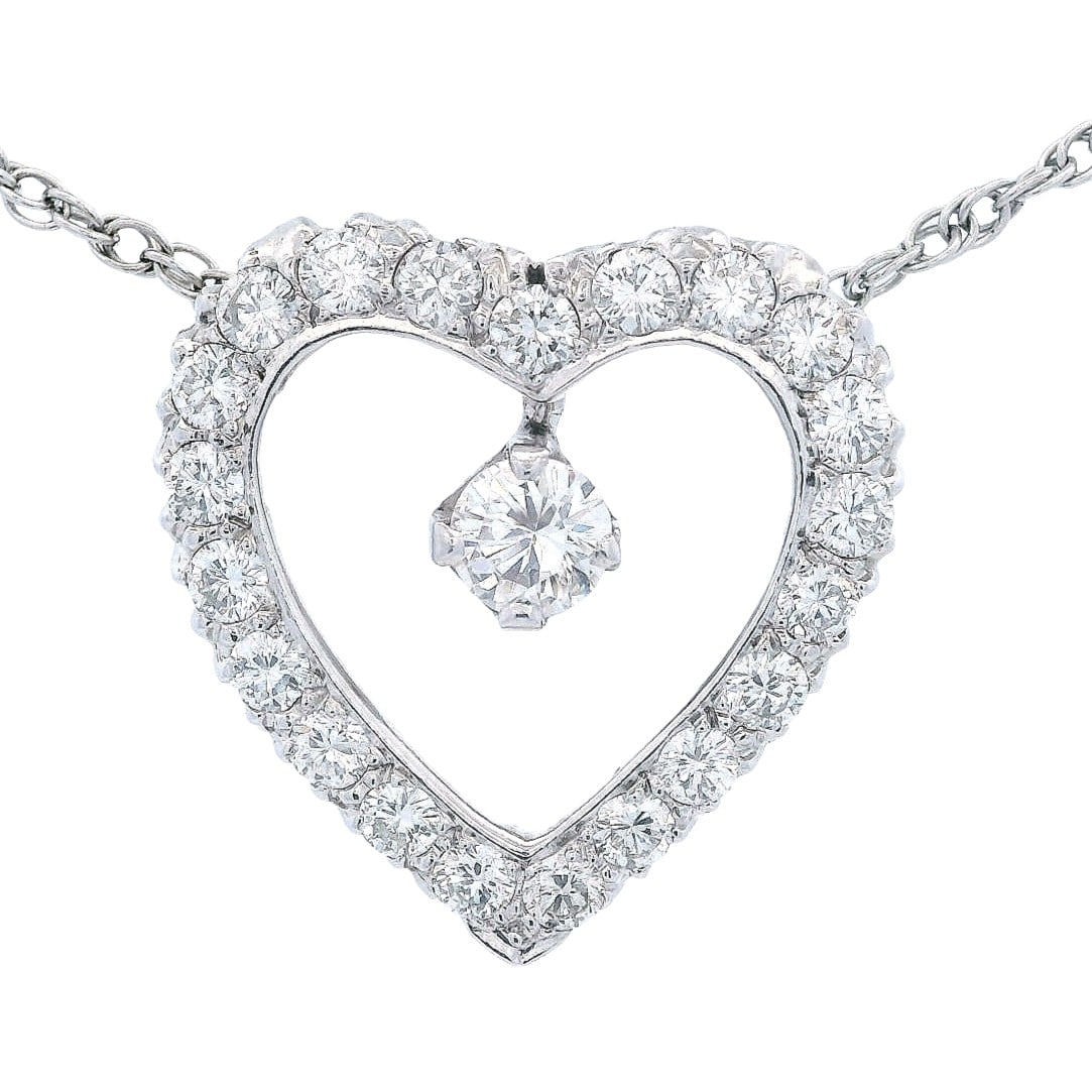 14kt white Gold heart Necklace with 2.00 Cts in Diamonds: 14kt white Gold Heart Necklace, accenter with a center 0.40 carats. F-G color, VS1 clarity. Along with 20 Round cut Diamonds weighing Approx. 1.60 carats. F-G color, VS1 clarity. Heart measurements: 0