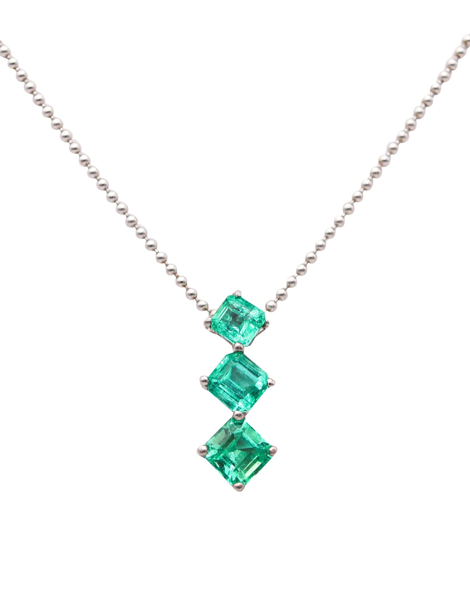 COLOMBIAN EMERALDS Necklace Chain Pendant In 14Kt White Gold With 1.65 Carats: Italy. Modernist bead-chain pendant necklace crafted in high-polish 14K white gold, featuring a three-stone drop pendant set with 3 graduated square-cut Colombian emeralds from the Muzo mines, four-pr