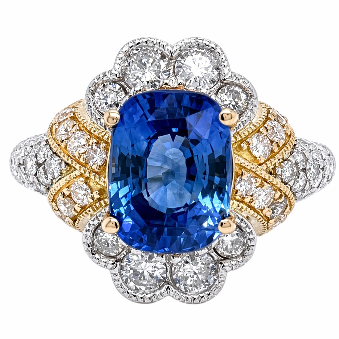 GIA 18K White & Yellow Gold Ring with 4.69 CTW in Sapphire & Diamond: 18K White & Yellow Gold GIA Certified Sapphire & Diamond Ring, weighing 8.3 grams, centered by a vivid GIA-certified 3.58 ct sapphire measuring 9.76 x 7.26 x 5.19 mm (GIA #6213487956), framed by 1.11 