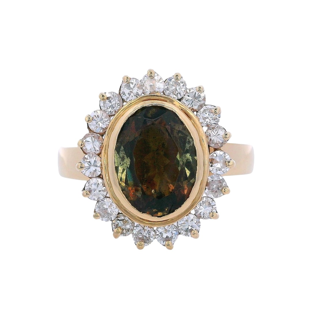 18K Yellow Gold Ring with 11.25 CTW in Andalusite & Diamond: Vintage 18K yellow gold ring showcasing a striking oval Andalusite center piece weighing approximately 10.50 carats, encircled by 19 diamonds totaling approximately 0.75 carats (H–J color, SI1 clari