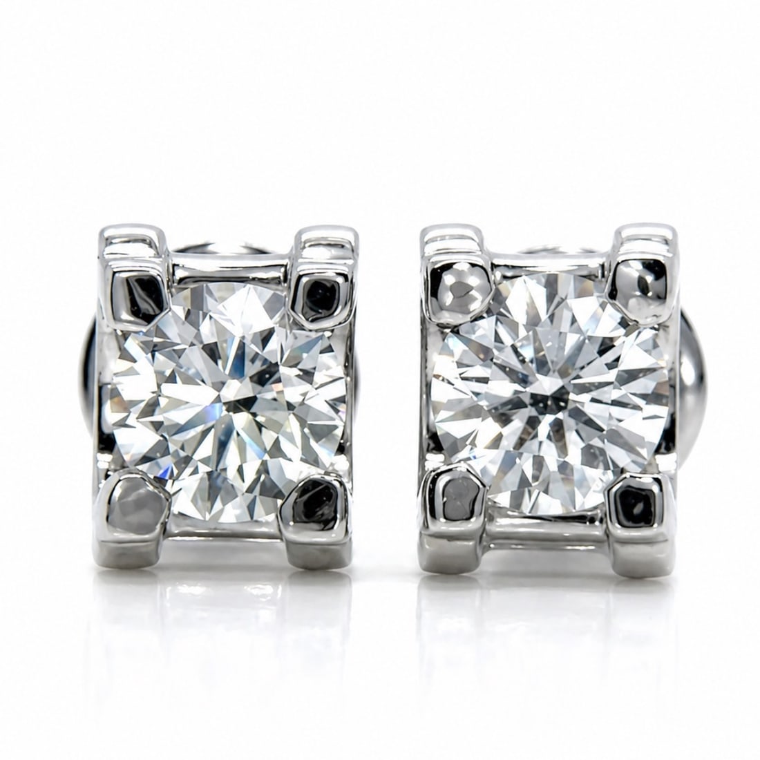CARTIER 18K White Gold Earrings with 2.01 CTW in Diamond: CARTIER 18K White Gold Diamond Stud Earrings, weighing 6.5 grams, set with two GIA-certified diamonds totaling 2.01 cts: one 1.01 ct (G color, SI1 clarity) measuring 6.31–6.35 x 4.01 mm (GIA #215674