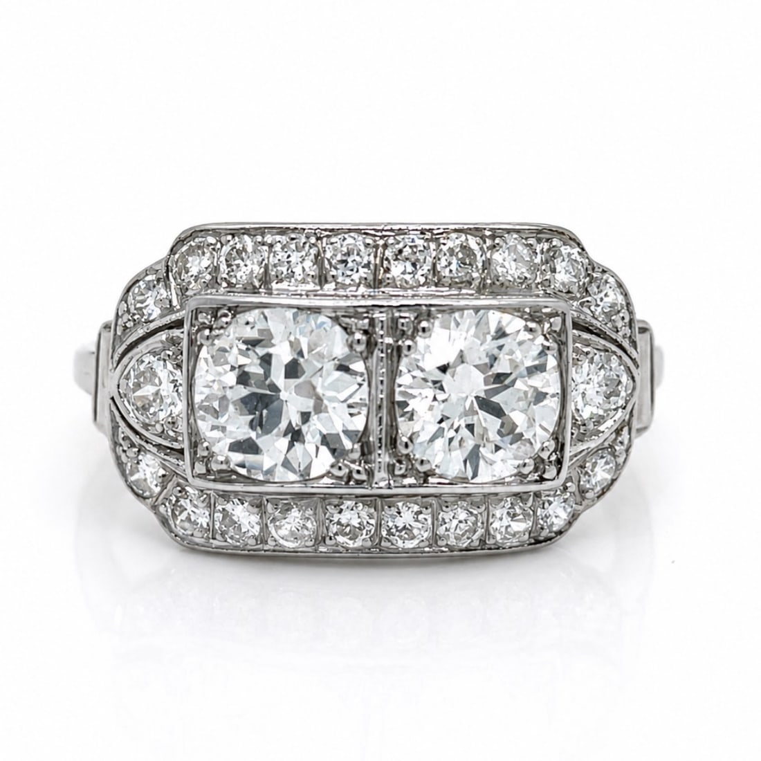 Art Deco Platinum Ring with 1.75 CTW in Diamond: Art Deco platinum ring set with 2 European-cut diamonds totaling approx. 1.30 ctw (F–G color, VVS–VS clarity; small chips on girdles) and 22 European-cut diamonds totaling approx. 0.45 ctw (F–G 