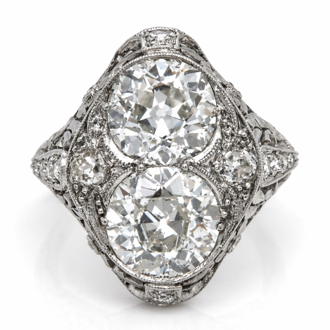 Art Deco Platinum Ring with 4.60 CTW in Diamond: Art Deco Platinum Diamond Ring, weighing 6.9 grams, set with two old mine diamonds totaling approx. 4.00 cts (H–I color, VS1–SI1 clarity), accenter by an additional 16 diamonds totaling approx. 0.