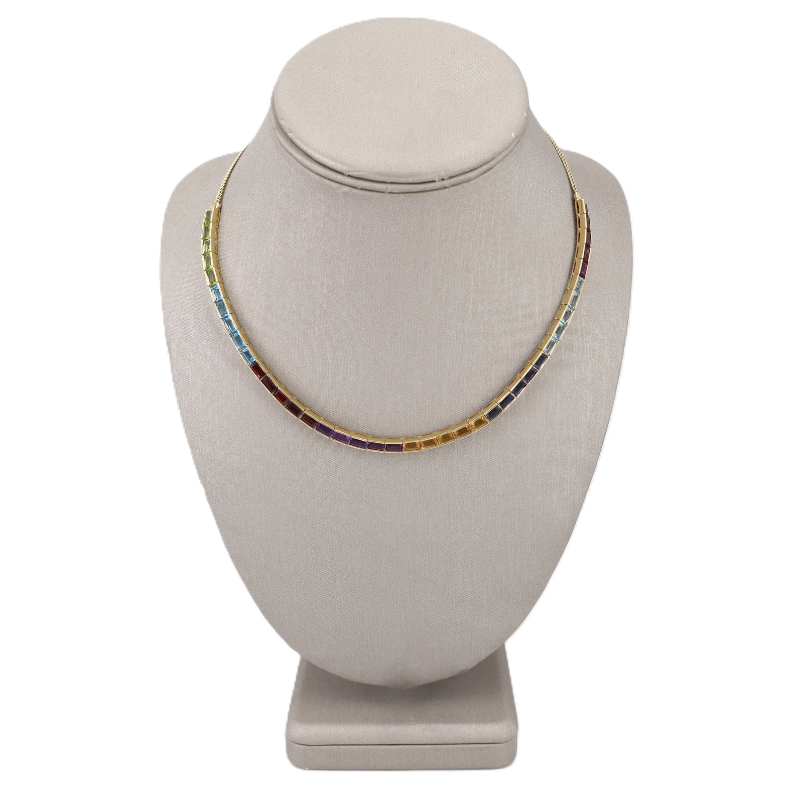 18K Yellow Gold Rainbow Necklace with 16.00 CTW in Multi-Stone: 18K yellow gold rainbow semi-precious stone necklace, weighing 19.6 grams, accenter with 40 semi-precious stones totaling approx. 16.00 cts, featuring a vibrant spectrum including peridot, blue topaz,