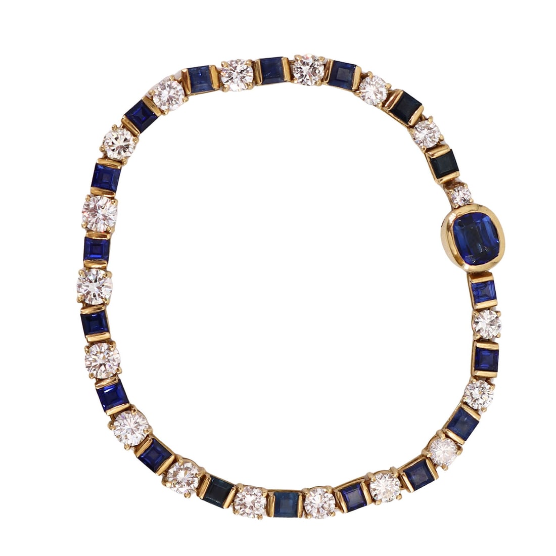 18kt yellow Gold Bracelet with 12.0 CTW in Sapphires and Diamonds: 18kt yellow Gold Bracelet accenter with 18 square cut and one Oval cut blue Sapphires weighing together Approx. 6.70 carats. Along with 18 graduated Round cut Diamonds weighing Approx. 5.30 carats. F-