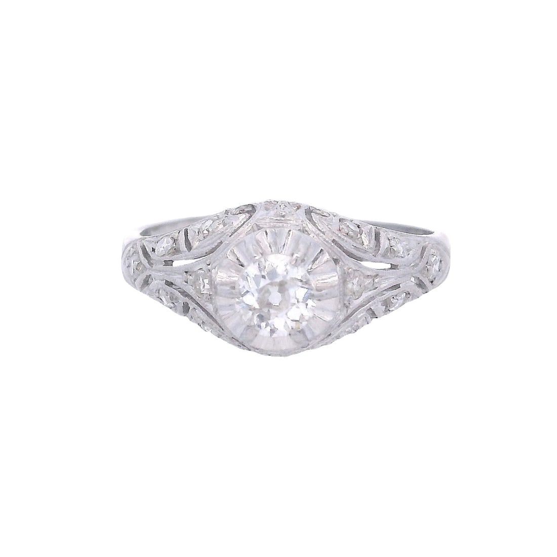 Art Deco Filigree Platinum Engagement Ring with Diamonds: Circa 1920s. Art Deco Filigree Engagement Ring crafted from Platinum. Accenter with a center Old mine Diamond of Approx. 0.32 carats. H-I color, I1 clarity. Accenter with Rose cut Diamonds. Ring size: