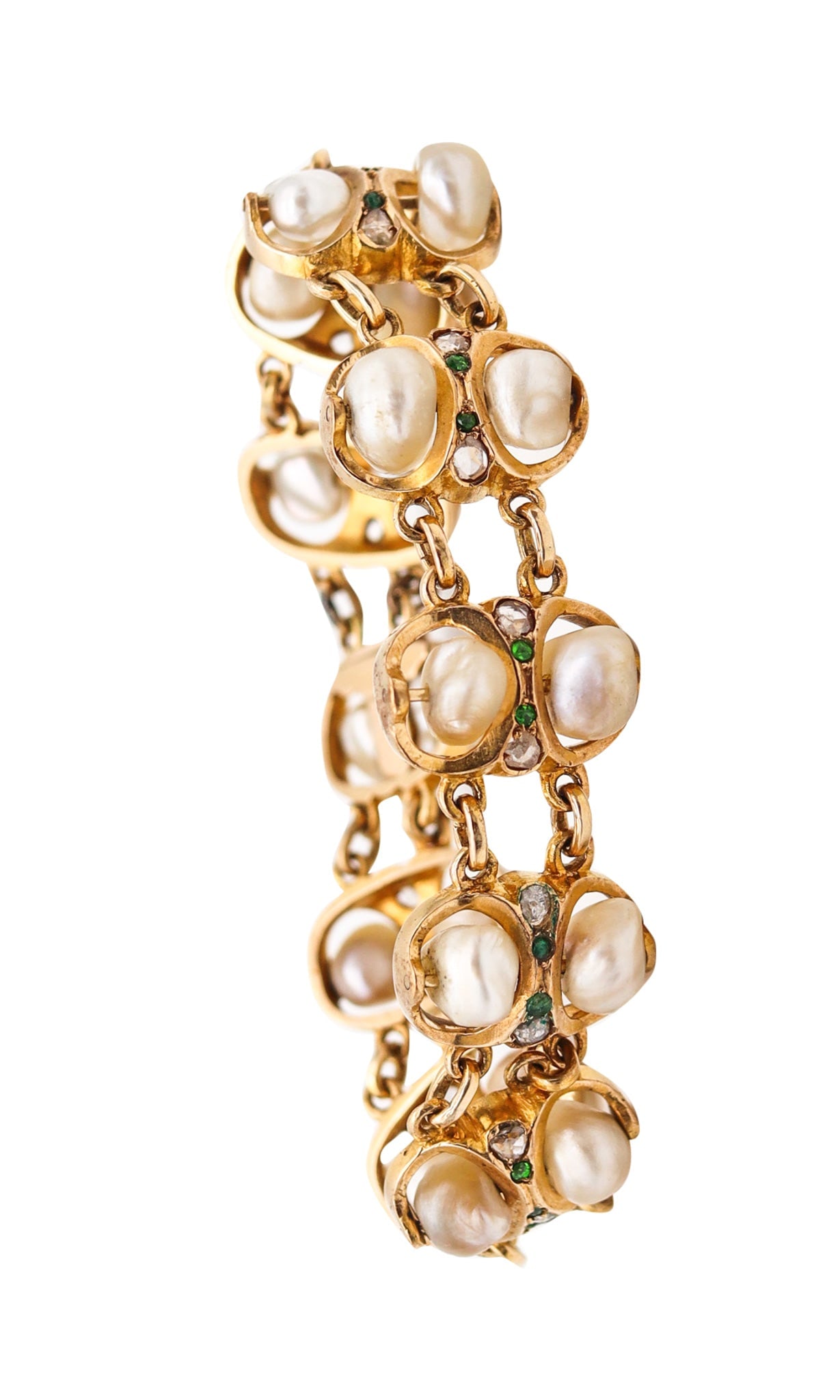 ART & CRAFT 1900 Natural Pearls Bracelet In 14-18Kt Gold With Diamonds & Demantoid: United States, turn of the century (c. 1900). Antique bracelet in mixed Victorian / Arts & Crafts taste, crafted in 14K and 18K yellow gold with ten intricate gem-set links and a security push box cla