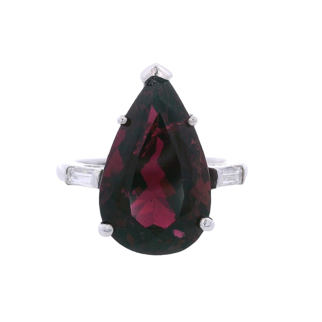 18kt white Gold Tourmaline & Diamonds Ring: 18kt white Gold Ring featuring a center pear shaped Tourmaline of Approx. 8.90 carats. Along with two Baguette cut Diamonds on the sides of Approx. 0.25 carats. H color, VS1 clarity. Ring size: 7 1/4.