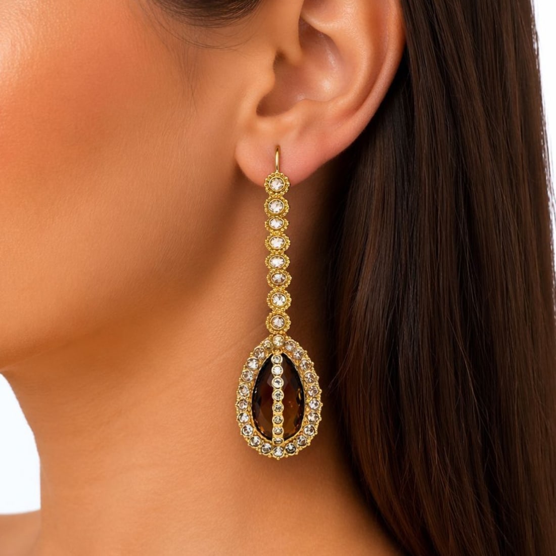 18K Yellow Gold Earrings with 18.30 CTW in Smokey Quartz & Diamond: 18K Yellow Gold Smokey Quartz & Diamond Earrings, weighing 17.8 grams, set with two smokey quartzes totaling approx. 15.00 cts, suspended as dramatic drops with rich, warm brown tone and elegant movem