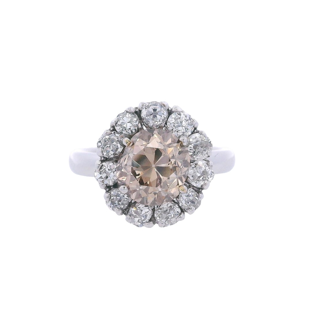 18kt white Cluster Ring with 3.73 CTW in Diamonds: 18kt white Gold Cluster Ring featuring a center Old mine Brown Diamond of Approx. 2.33 carats. VS1 clarity. Surrounded by 11 old mine cut Diamonds weighing together Approx. 1.30 carats. H- J color, VS