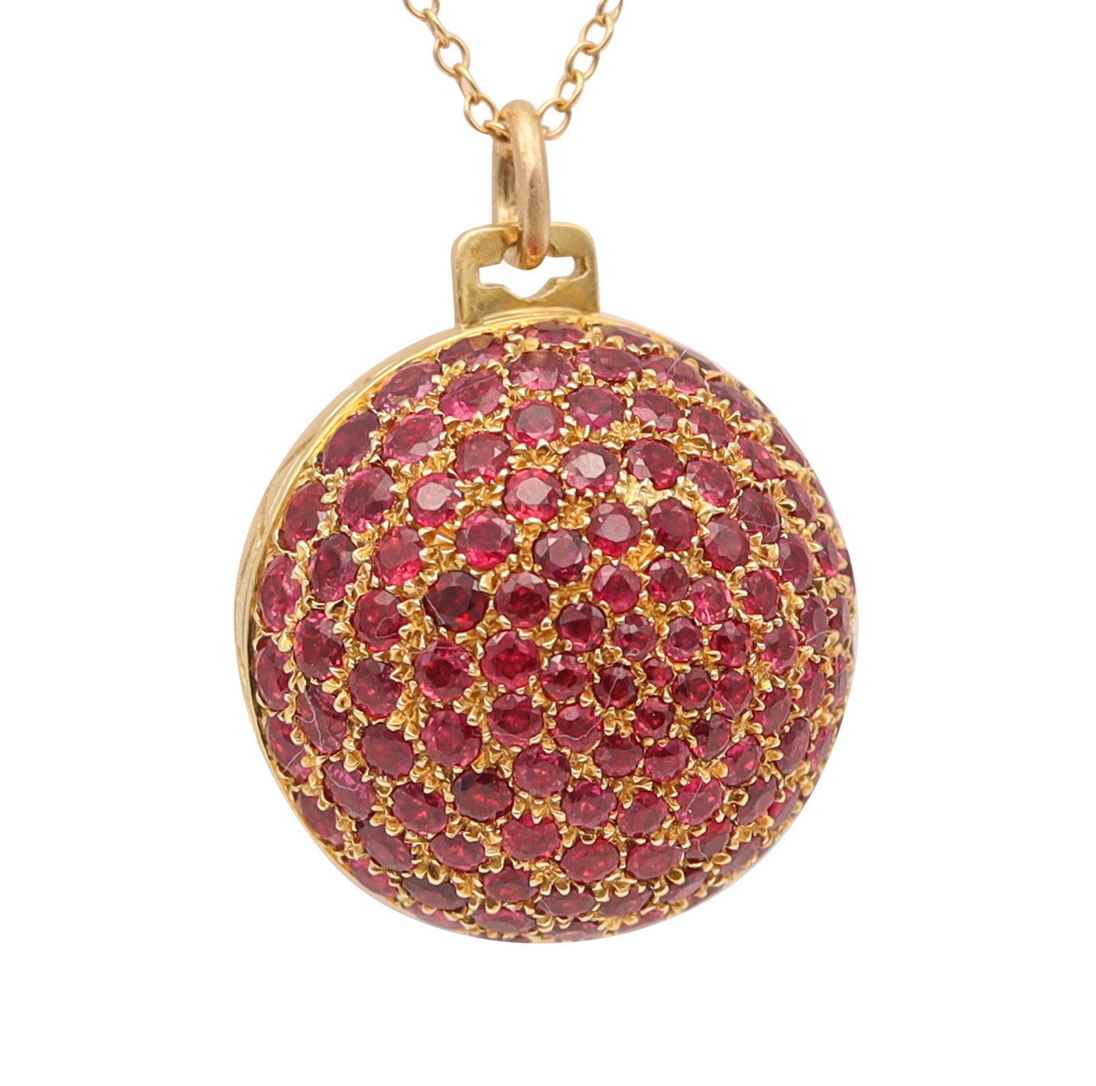 GUCCI 1970 Milano Secret Box Ball Pendant In 18Kt Gold With 8.35 Ctw Rubies: Milano, Italy (c. 1970). Rare Gucci secret-box ball pendant designed as a sculptural jeweled sphere with crocodile-skin style imprinting, crafted in 18K yellow gold and set with 119 calibrated Burmese