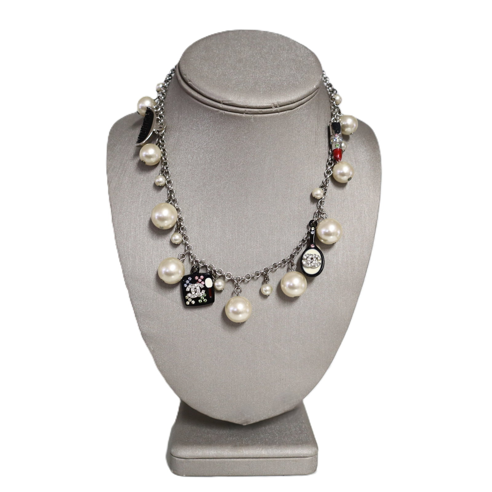 Chanel Vintage Make Up Charm Beaded Faux Pearl Chain Necklace: This beautiful Chanel necklace features beaded faux pearls with chain links between and adorable acrylic beauty charms throughout. The charms include one round mirror with black backs and multi-colore