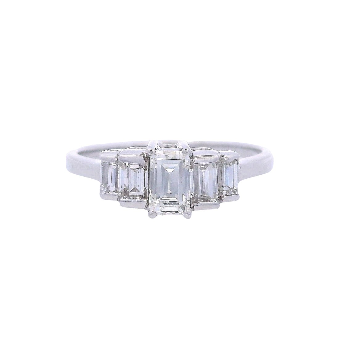 18kt white Gold Ring with Diamonds: 18kt white Gold Ring featuring a center Baguette cut Diamond Approx. 0.36 carats. F-G color, VS1 clarity. Along with four Baguette cut Diamonds on the sides weighing together Approx. 0.55 carats. F-G 
