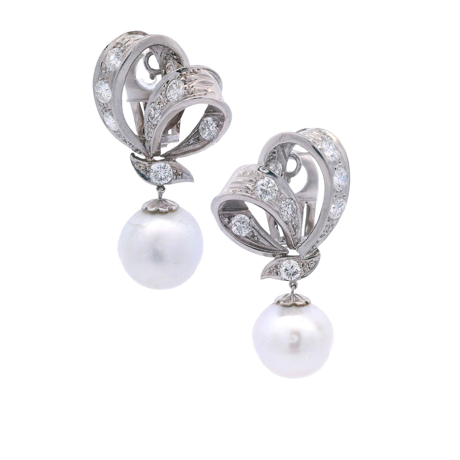 Antique 18kt white Gold Earrings with Diamonds & South Sea Pearls: Pair of Antique Drop Earrings featuring two South Sea Pearls of 13.50 mm accenter with European cut Diamonds weighing together Approx. 2.40 carats. G-H color, VS2 clarity. Measurements: 1.50 x 0.80 in