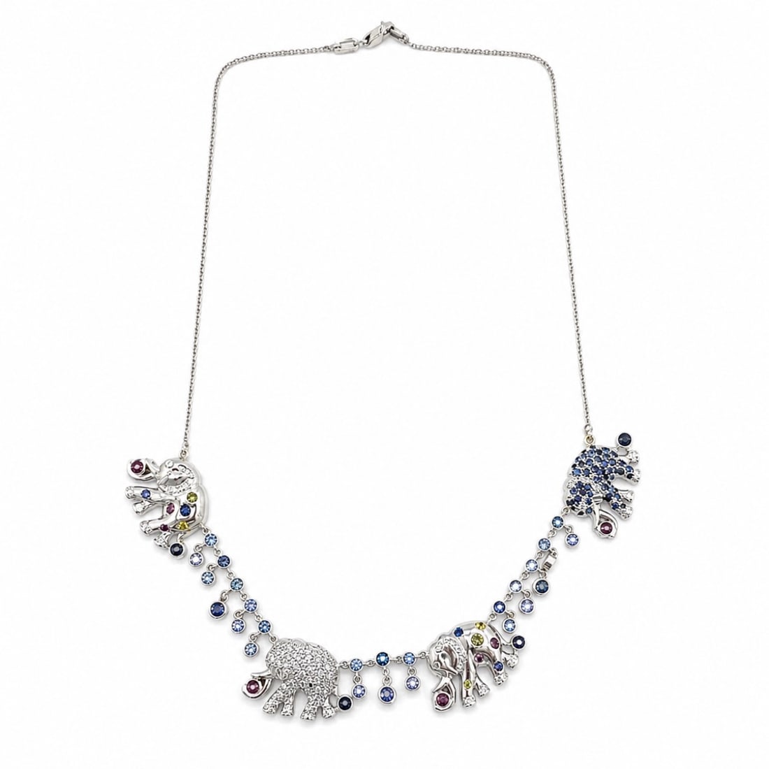 18K White Gold Necklace with 5.50 CTW in Colored Stone & Diamond: 18K white gold charm necklace featuring elephant motifs and cascading stations, set with diamonds totaling approximately 2.00 ctw (G–I color, VS1–SI1 clarity) and colored stones totaling approxima