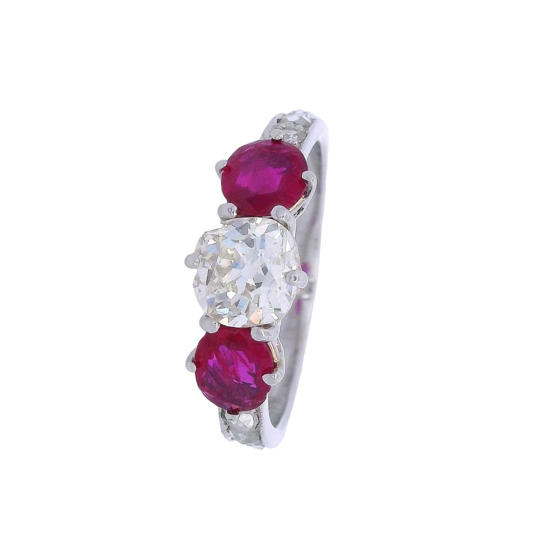Vintage 18kt white Gold Ring with .09 Cts Diamond & Burma Rubies: Vintage Ring crafted form 18kt white Gold, featuring a center Old mine cut Diamond of Approx. 1.09 carats. L-M color, VS2 clarity. Along with two Burma Rubies on the side weighing together Approx. 1.1