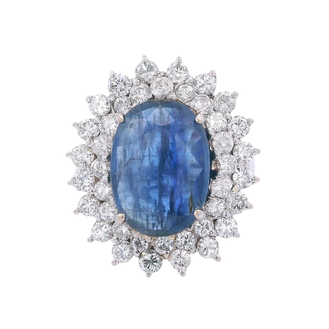 18kt white Gold Halo Ring with 9.58 CTW Sapphire & Diamonds: Halo Ring crafted from 18kt white Gold, featuring a center Oval cut Blue Sapphire of Approx. 7.30 carats. Surrounded by Round cut Diamonds weighing together Approx. 2.28 carats. H-I color, VS2-SI1 Cla