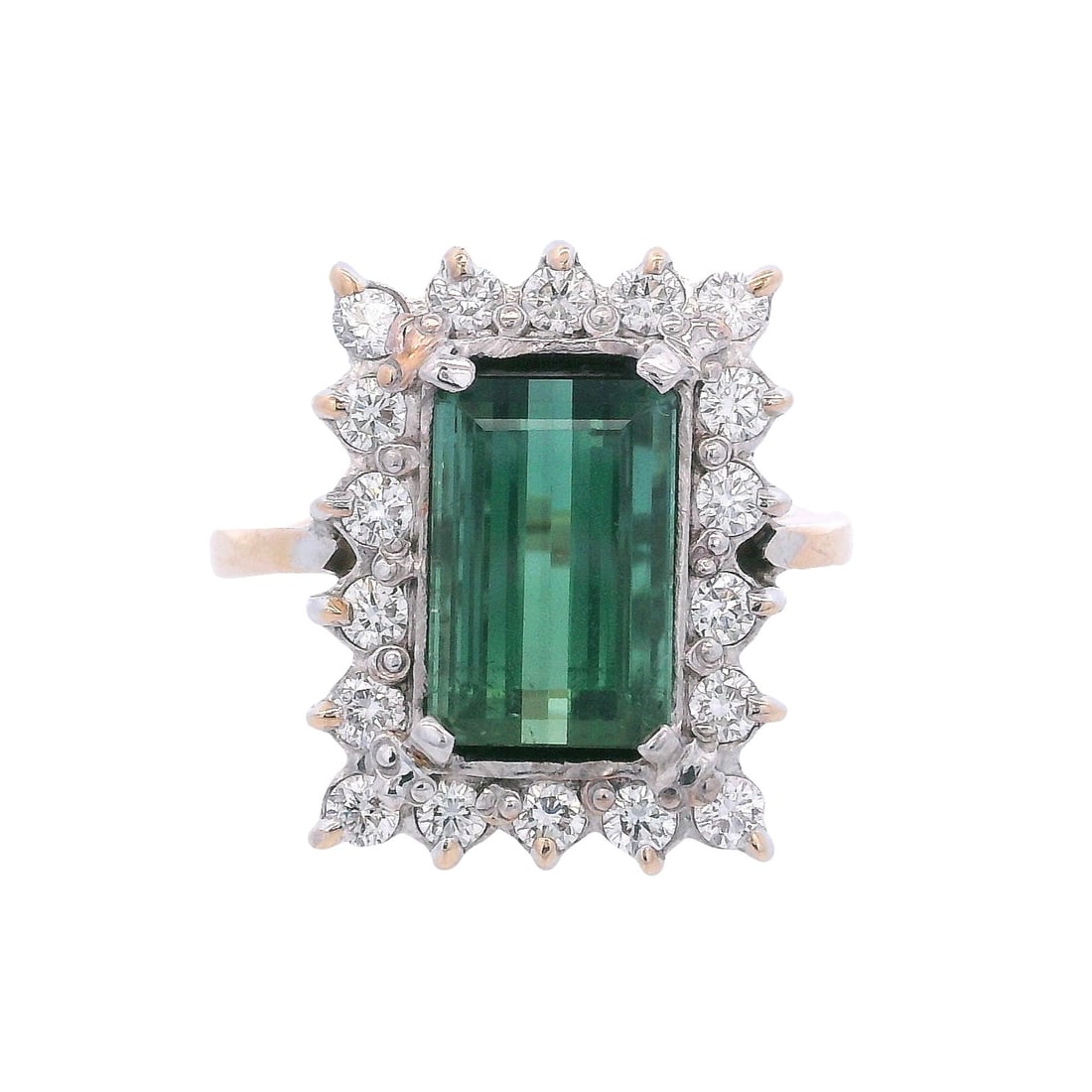 18kt two tones Ring 3.50 CTW in Green Tourmaline & Diamonds: 18kt yellow and white Gold Ring featuring a center Emerald cut Green Tourmaline of Approx. 2.80 carats. Surrounded by 18 Round cut Diamonds weighing together Approx. 0.70 carats. G-H color, VS2 clarit