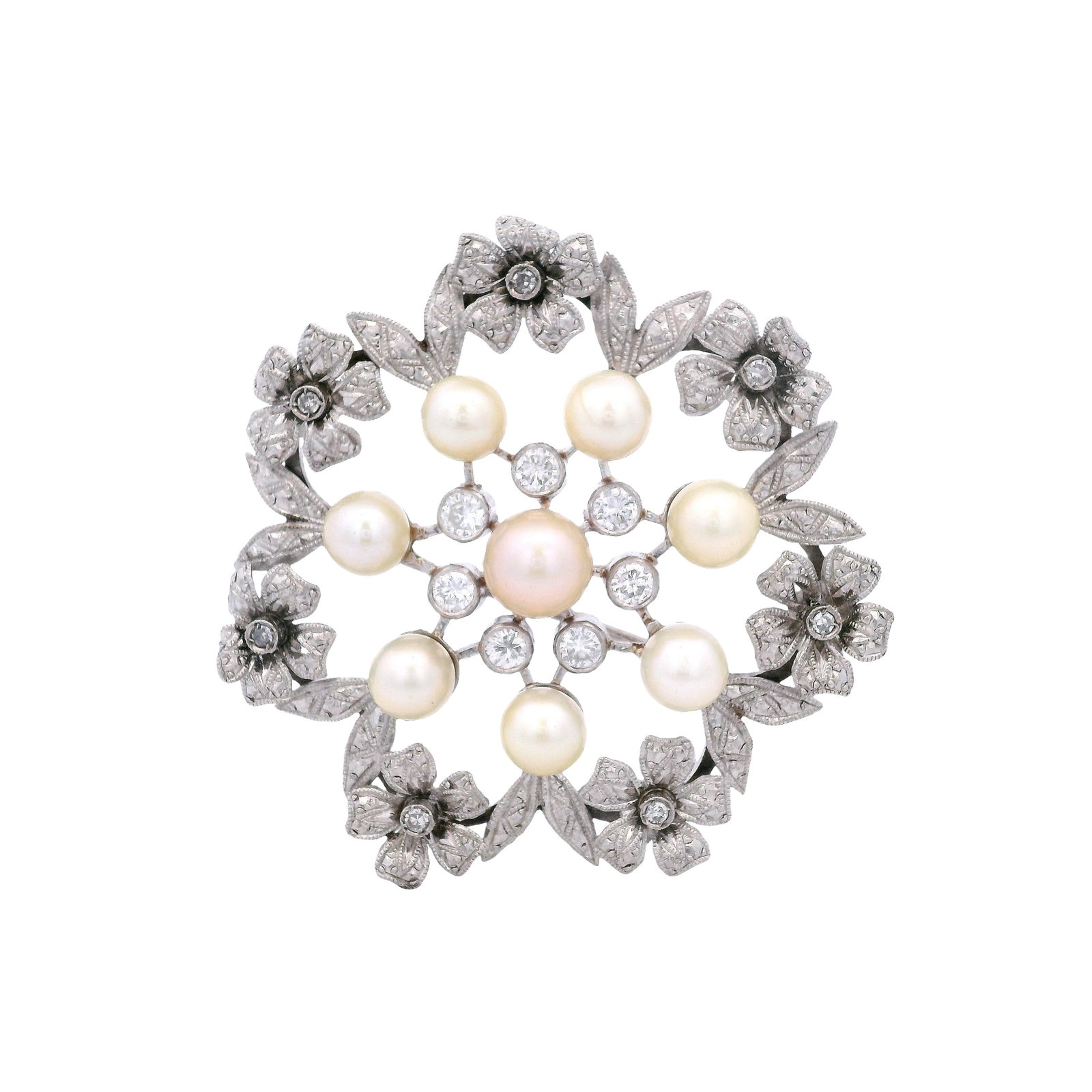 Antique Platinum flower Brooch with Diamonds and Pearls: Antique flower Brooch crafted in Platinum, featuring eight round cream pearls about 6.0 to 7.4 mm diameter. Accenter with seven Round cut Diamonds weighing together Approx. 0.70 carats. H color, VS-SI