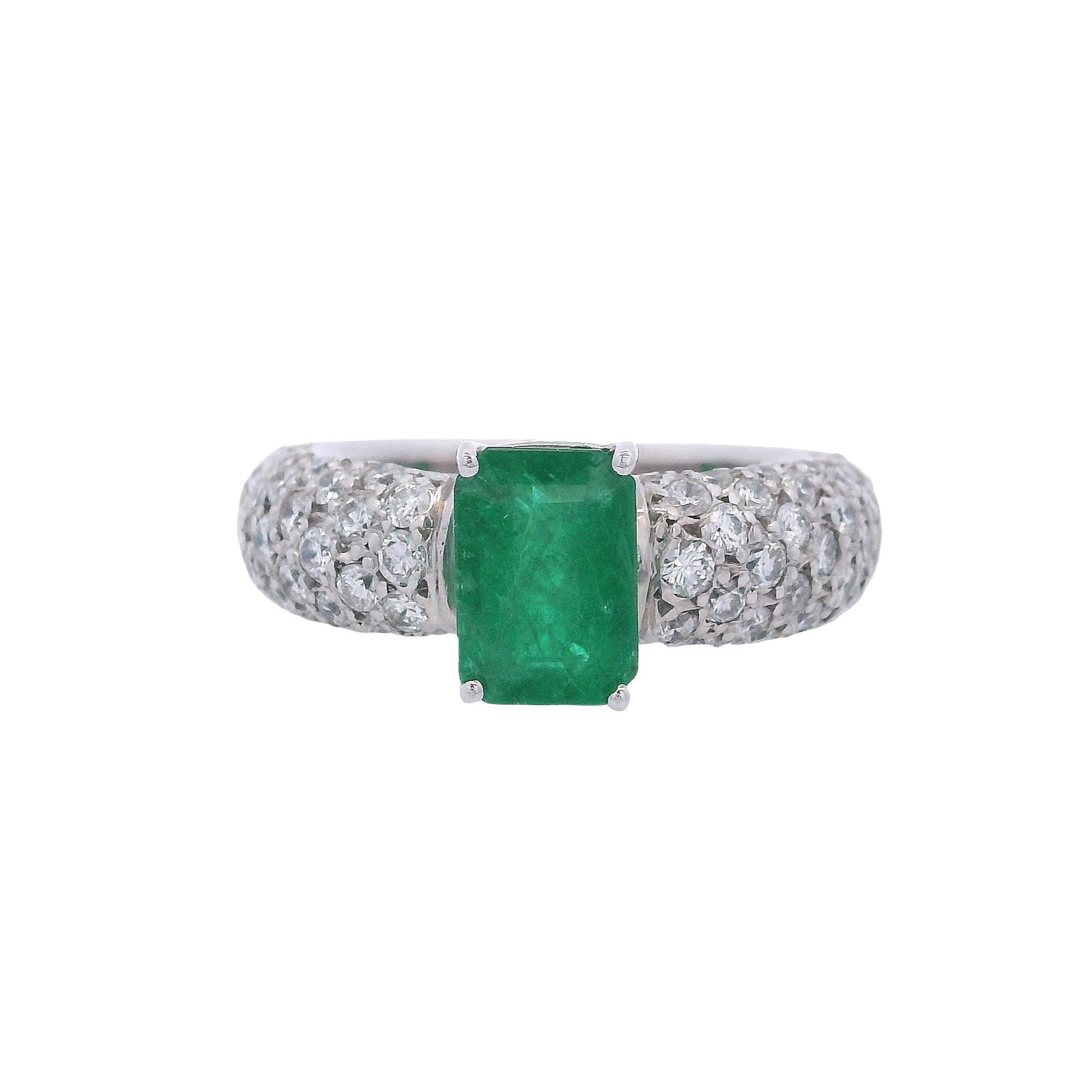 18kt white Gold Ring with Emerald & Diamonds: 18kt white Gold Ring featuring a center Emerald cut Emerald of Approx. 1.50 carats. Along with a pave of Round cut Diamonds weighing together Approx. 1.05 carats. F-G color, VS2 clarity. Ring size: 7.