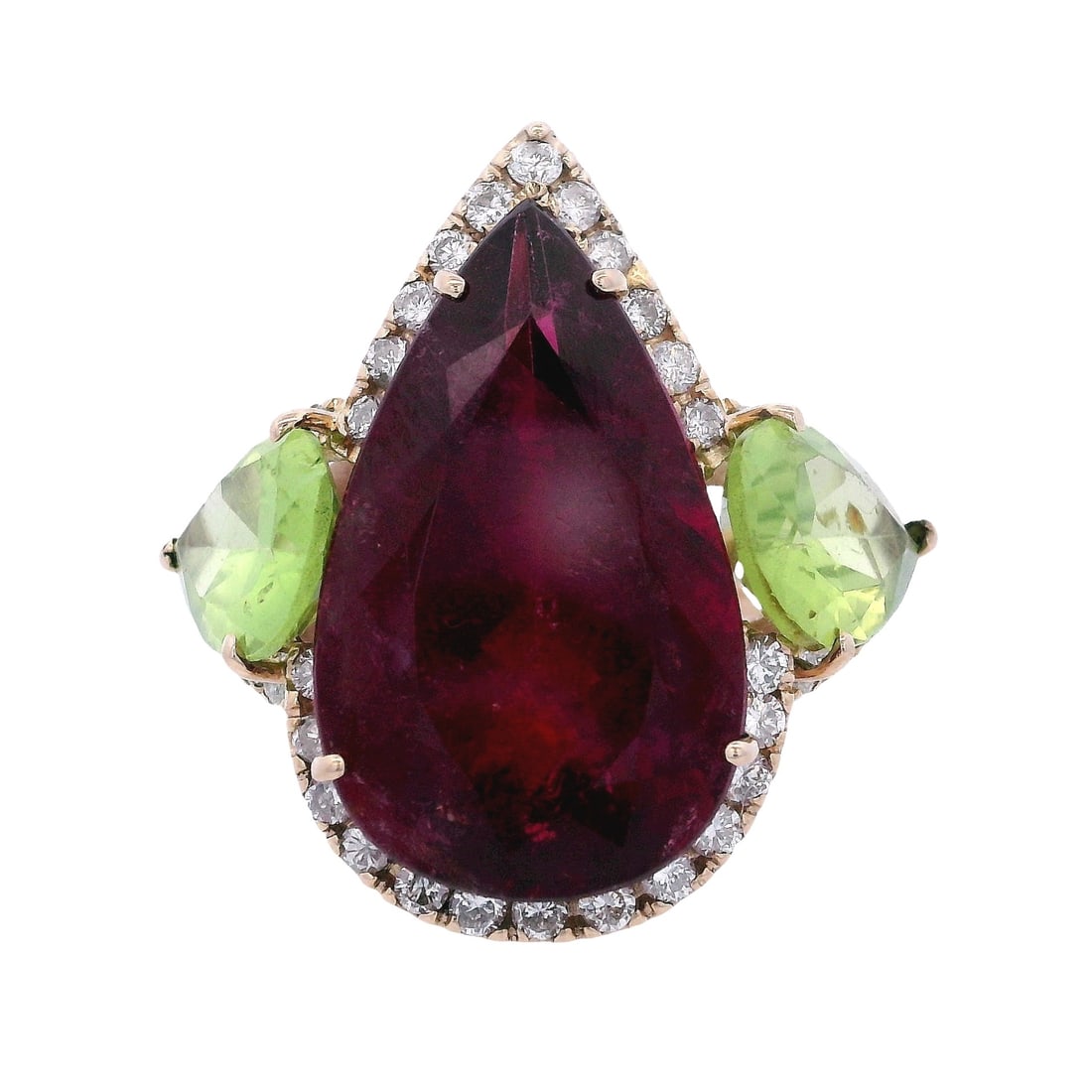 18kt yellow Gold Cocktail Ring with Red Tourmaline, Peridots & Diamonds: 18kt yellow Gold Cocktail Ring featuring a center Pear shape Red Tourmaline of Approx. 8.00 carats. Along with two Pear shape Peridots of Approx. 2.40 carats. Accenter with Round cut Diamonds weighing
