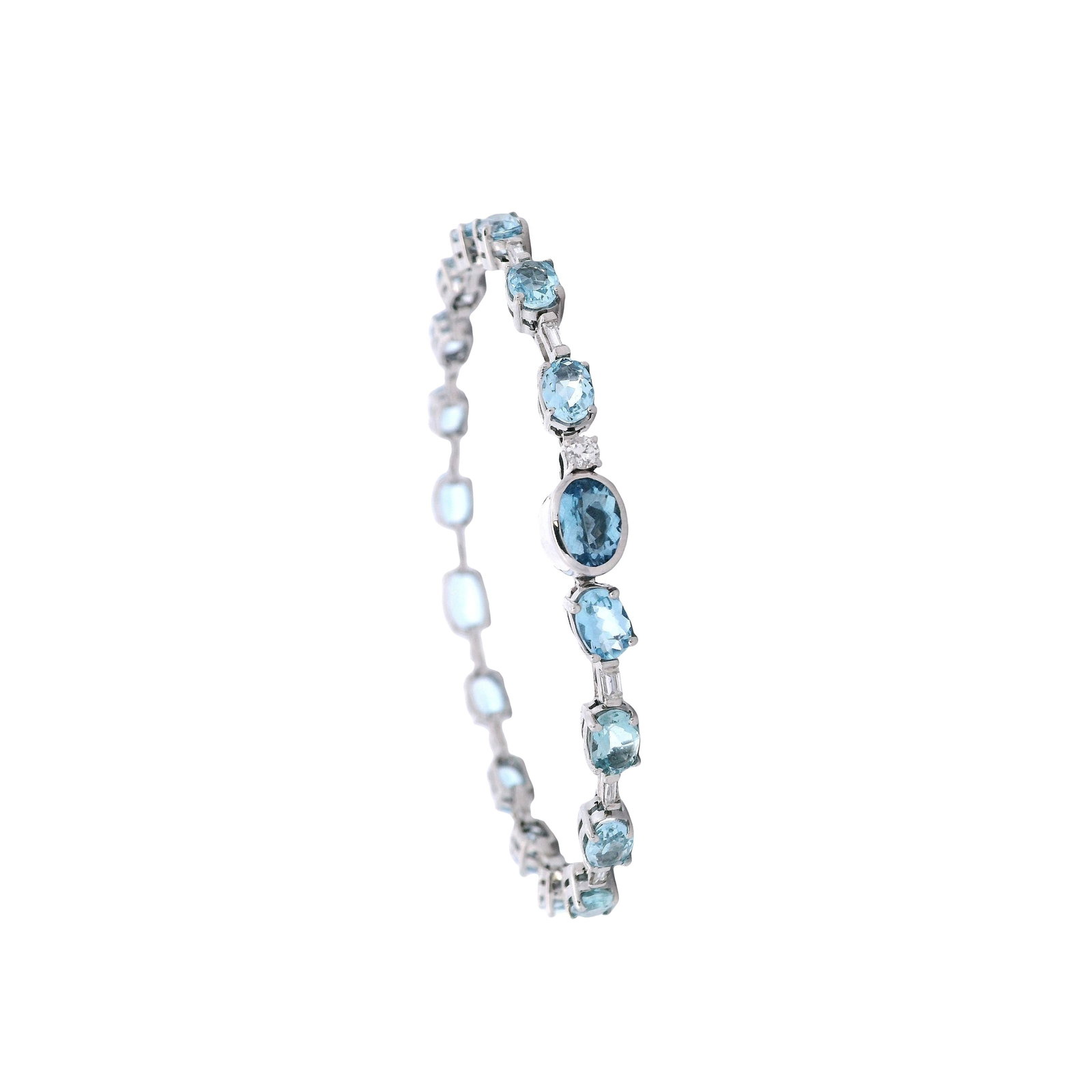 18K White Gold Bracelet with 15.40 CTW in Aquamarine & Diamond: 18K white gold bracelet set with 18 oval-cut Brazilian aquamarines totaling approximately 14.20 carats, complemented by 16 baguette-cut diamonds and one round-cut diamond totaling approximately 1.20 c