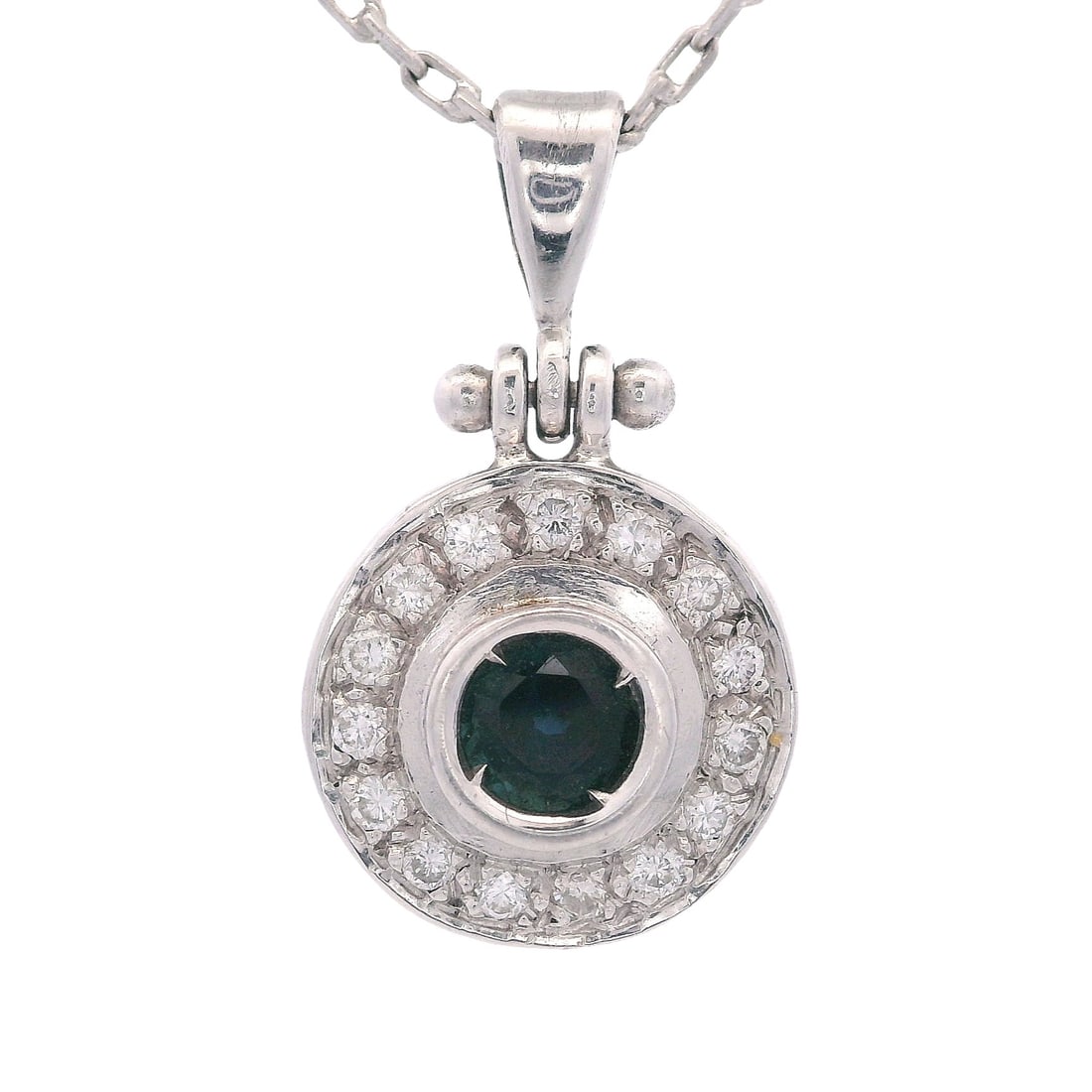 18K White Gold Pendant Necklace with 0.60 CTW in Sapphire & Diamonds: Classic, crisp, and endlessly wearable, this 18K white gold pendant necklace features a bright round-cut blue sapphire of approximately 0.40 carats, framed by 15 round-cut diamonds totaling approximat