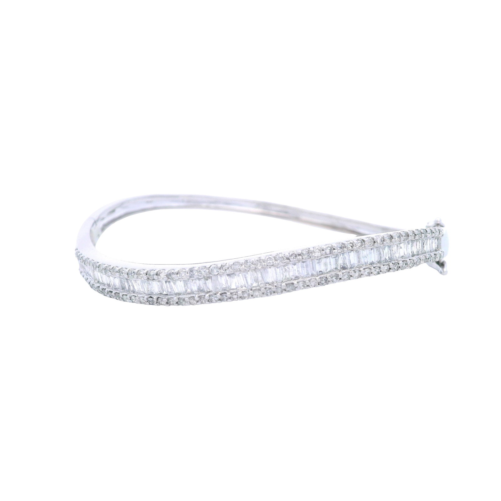 Wavy 14kt white Gold Bangle with 4.00 Cts in Diamonds: Wavy Bangle crafted from 14kt white Gold accented with Round cut and Baguette cut Diamonds weighing Approx. 4.00 carats. H-I color, VS2-SI2 clarity. Fits up to wrist size 7.0 inches. Total weight: 14.