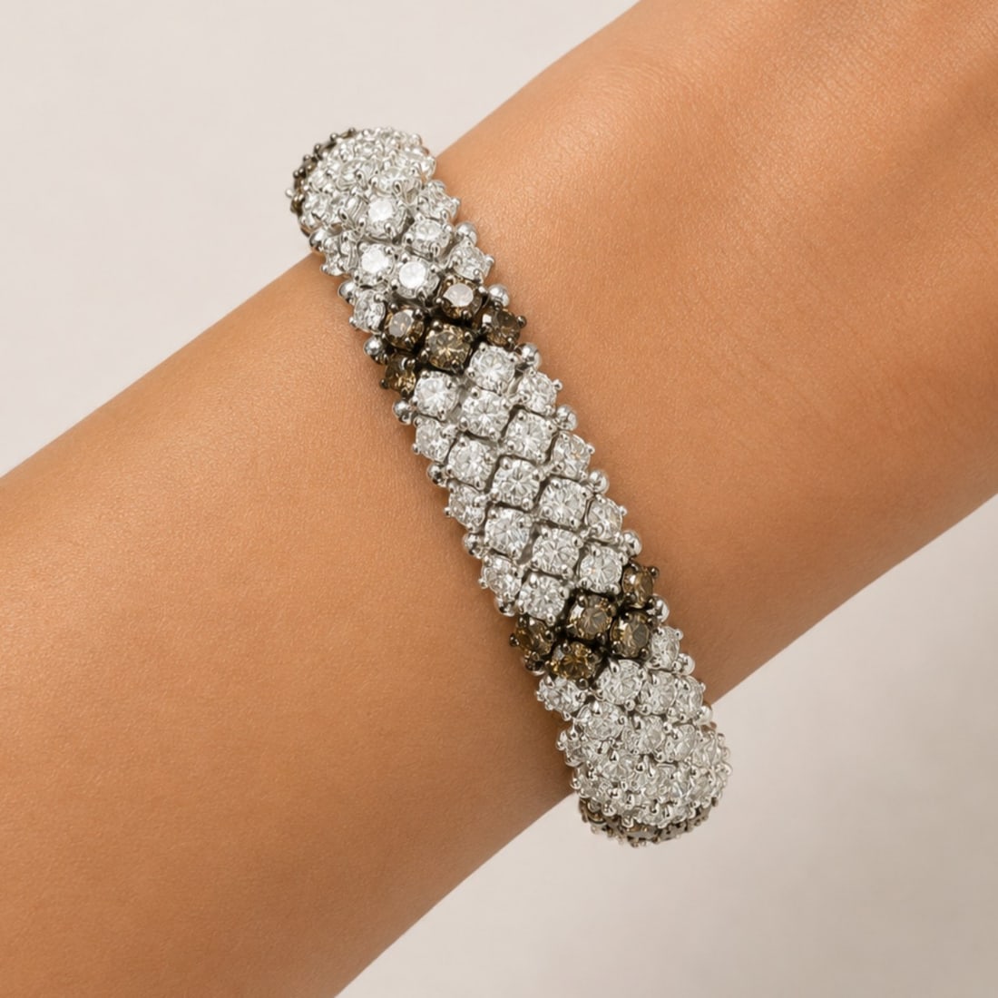 20K White Gold Bracelet with 20.25 CTW in Diamond & Champagne Diamond: Exceptional and high-impact, this 20K white gold bracelet is richly set with 145 diamonds totaling approximately 15.75 CTW in F–H color and VS1–VS2 clarity, delivering intense brilliance a
