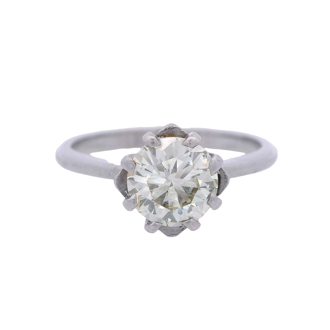 Antique Platinum Engagement Ring with 1.45 CTW Diamond: Antique platinum engagement ring showcasing an approximately 1.45-carat round-cut diamond with a beautifully warm L–M color and crisp VS1 clarity, offering impressive presence and classic brilli