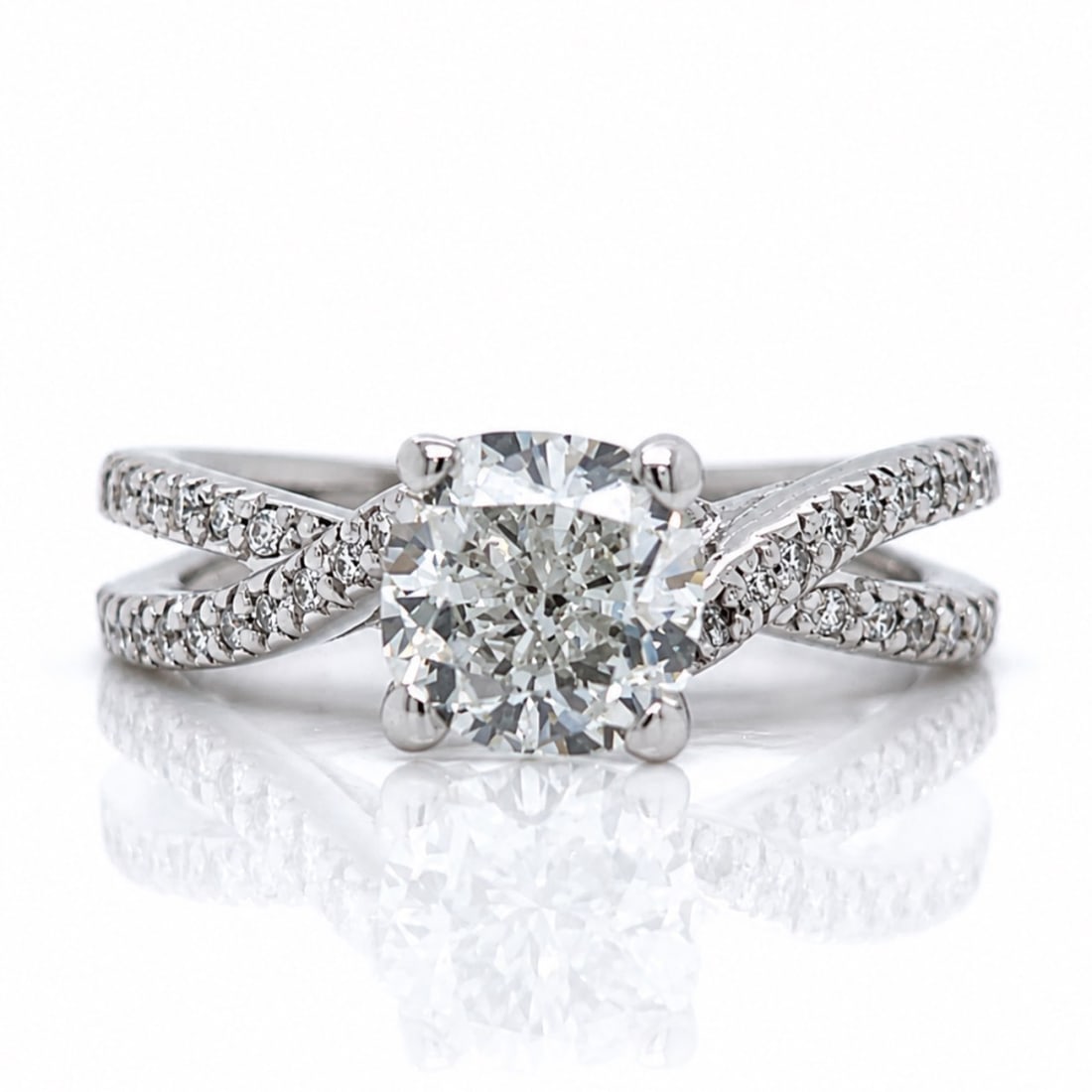 AGS 14K White Gold Ring with 1.90 CTW in Diamond: Elegant 14K white gold diamond ring set with an AGS certified cushion-cut diamond weighing 1.70 CTW in G color and SI1 clarity, measuring 6.68 x 6.66 x 4.58mm (AGS #104052264002). Accented with 44 add