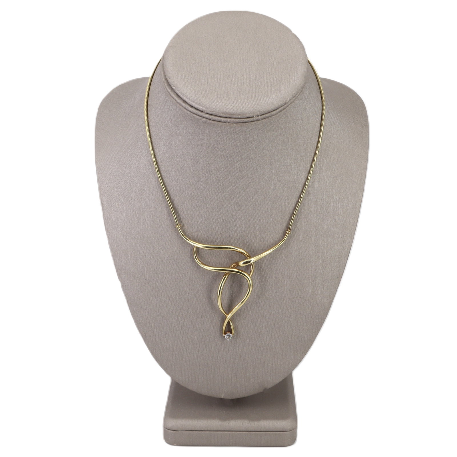 14K Yellow Gold Designer Necklace with 0.30 CTW in Diamonds: Sleek and sculptural, this designer 14K yellow gold necklace features a fluid wavy motif that sits high at the collarbone for a clean, modern look. A round brilliant-cut diamond of approximately 0.30 