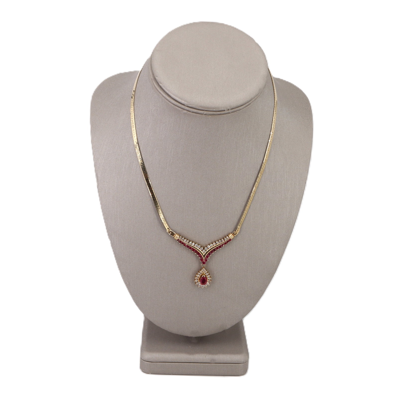14K Yellow Gold Necklace with 3.25 CTW in Rubies & Diamonds: Rich, romantic, and made to turn heads, this 14K yellow gold necklace centers on a vivid pear-shaped ruby of approximately 1.10 carats, complemented by 23 graduated rubies totaling approximately 1.10 