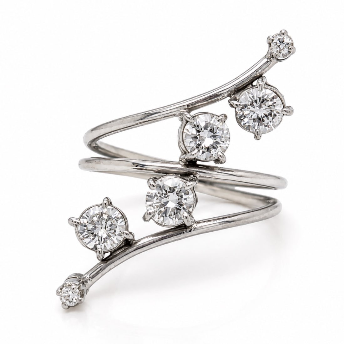 18K White Gold Ring with 1.25 CTW in Diamond: 18K white gold diamond ring set with four diamonds totaling approximately 1.20 CTW, accented with two additional diamonds totaling approximately 0.05 CTW, for a combined diamond weight of approximatel