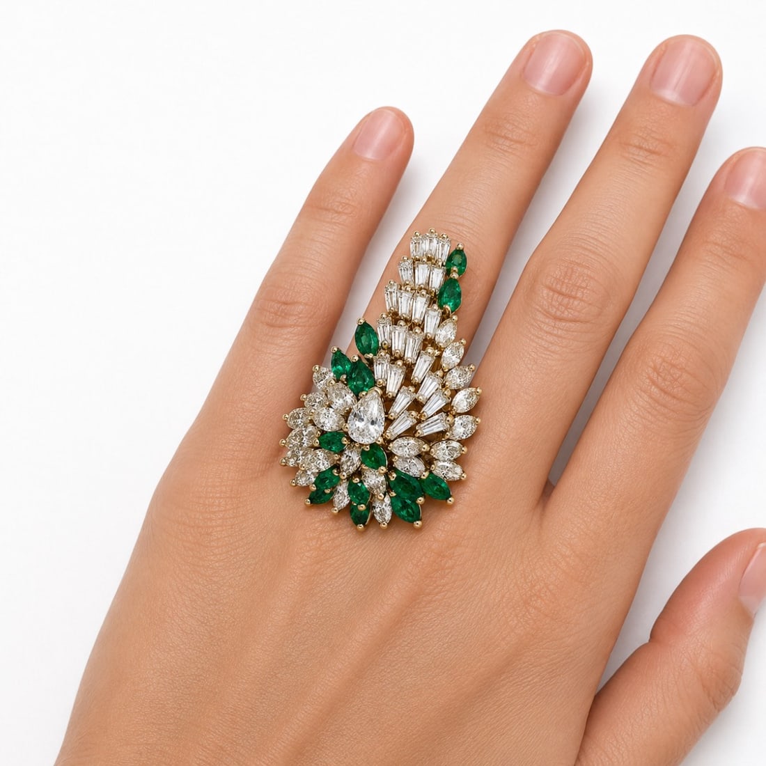 18K Yellow Gold Ring with 7.75 CTW in Emerald & Diamond: 18K yellow gold diamond and emerald ring set with 15 emeralds totaling approximately 2.10 CTW, accented with 21 baguette diamonds totaling approximately 2.20 CTW and 22 marquise diamonds totaling appr