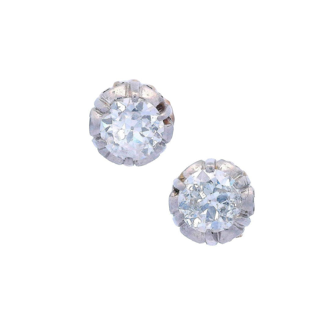 Antique Pair of Studs in 18kt Gold and Platinum with 1.00 CTS in Diamonds: Circa 1910s. Antique Pair of Studs crafted in 18kt yellow Gold and Platinum, featuring two transitional cut Diamonds weighing together Approx. 1.00 carats. F-G color, SI1 and I1 clarity (both eye clea