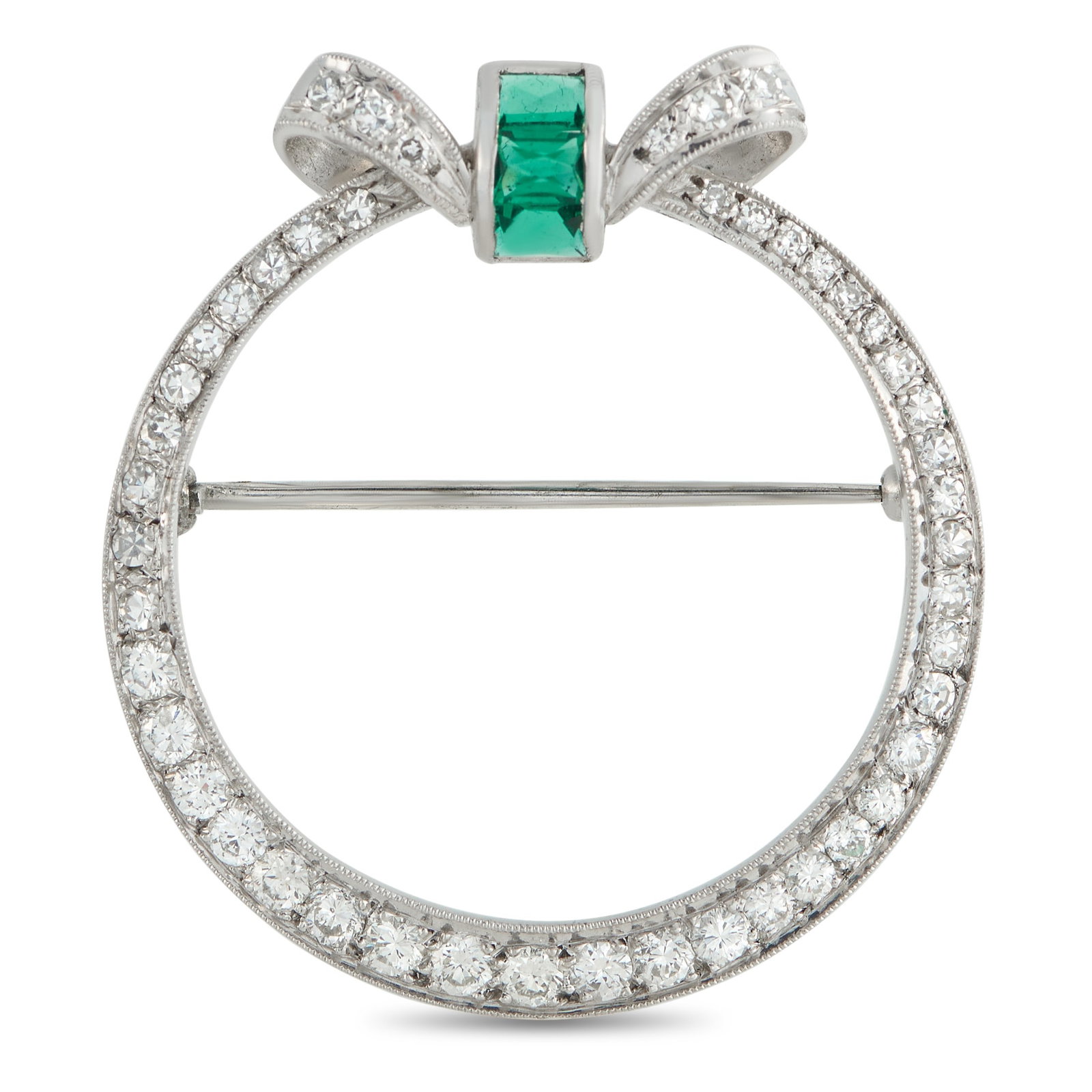 Platinum 0.85ct Diamond and Emerald Brooch: This luxury brooch is simple, elegant, and ideal for any occasion. The circular Platinum setting comes to life thanks to sparkling Diamonds with a total weight of 0.85 carats. At the top, Emeralds